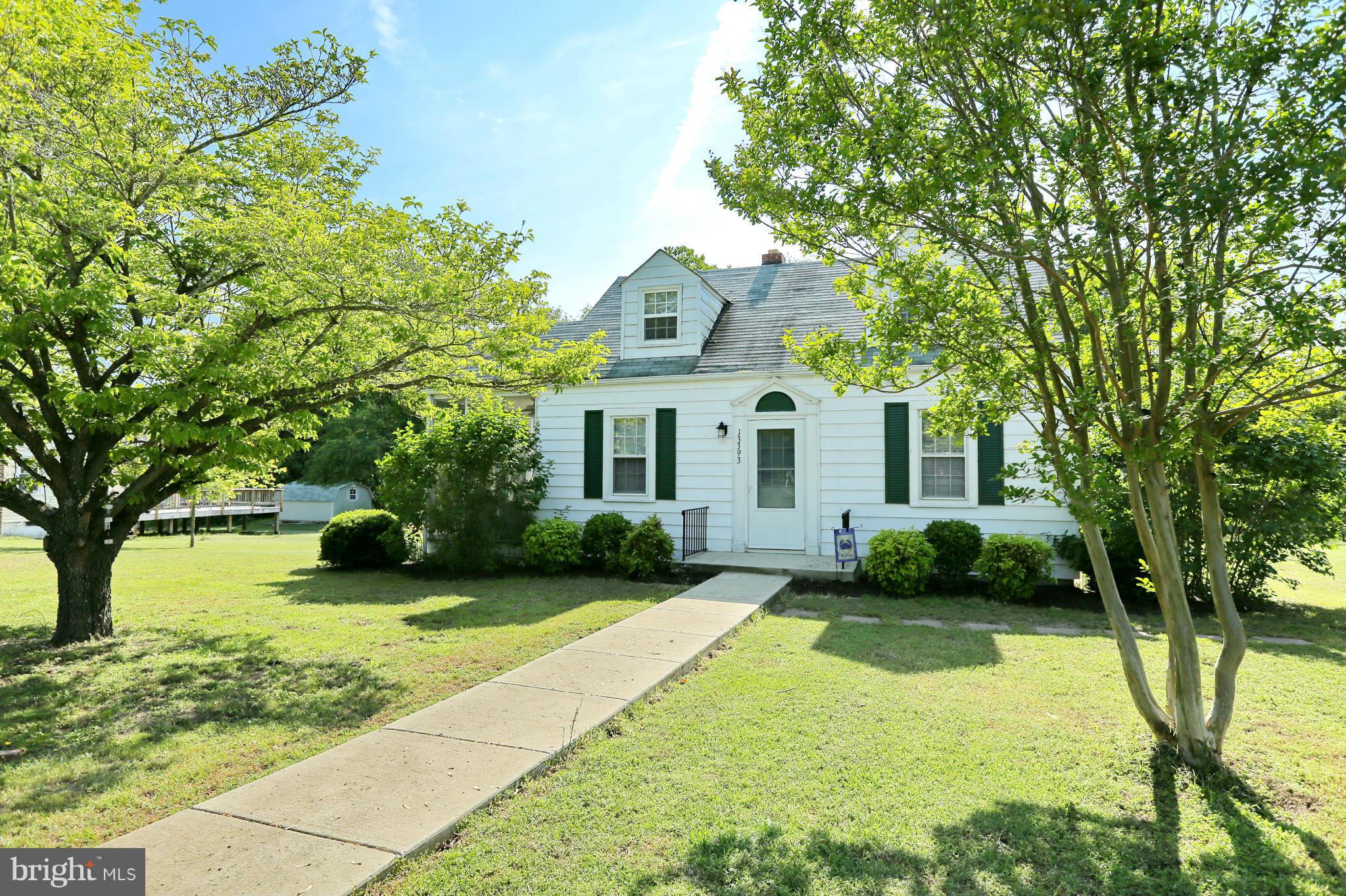 Adorable Cape Code with water views & beach access. Enjoy coffee in the mornings or dinners in the evenings in your screened in porch area with a great water view. Lots of upgrades through out, hardwood flooring. Master bathroom new 2015, tasteful & modern. Great lot with beautiful, mature landscaping