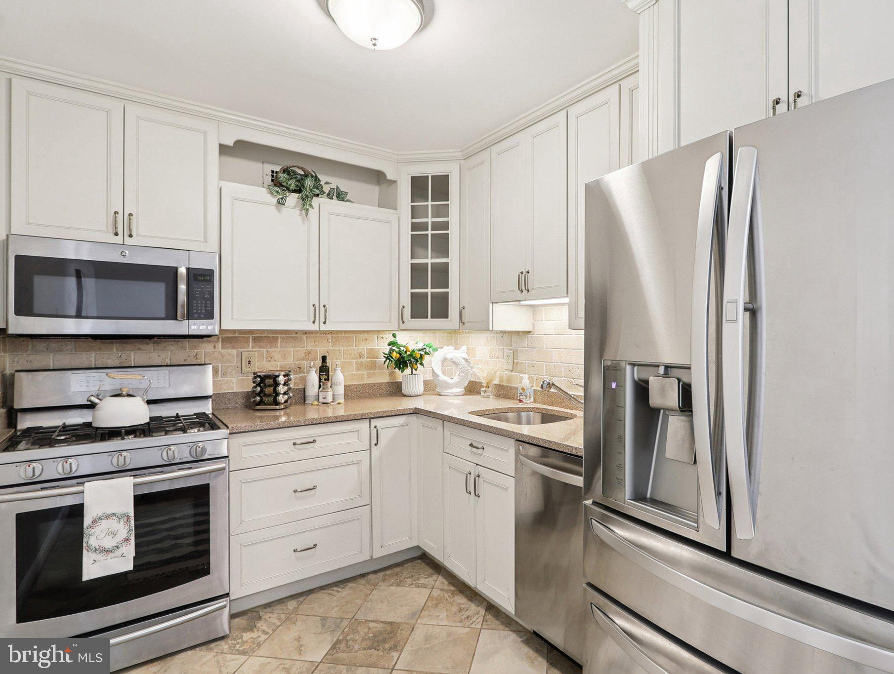 Welcome to Whitehall—one of Bethesda’s most desirable communities, ideally located next to the NIH campus and just moments from the Metro. Whether you're searching for a stylish place to call home or a prime rental investment opportunity in a high-demand rental market, this beautifully updated 2-bedroom, 1-bath residence checks every box. This sun-filled home offers breathtaking skyline views of Bethesda and features a private detached garage parking space, a rare feature available to only a select number of units in the building. Freshly painted throughout, the unit showcases a renovated kitchen with premium stainless-steel appliances, elegant Silestone countertops, modern cabinetry, and tasteful ceramic tile accents. Large south-facing windows flood the space with natural light, while the private balcony provides the perfect setting to enjoy morning coffee, city views, and fresh air year-round. Additional highlights include a dedicated storage unit and the convenience of secure garage parking. For investors, the unbeatable location next to NIH, the Metro, and Downtown Bethesda makes this an attractive rental property with strong tenant appeal and long-term value potential.

Whitehall amenities include a staffed front desk, fitness center, outdoor swimming pool, guest parking, on-site management, and beautifully maintained common areas with completed enhancements to the lobby, hallways, and balconies. Step outside and enjoy everything Bethesda has to offer—award-winning restaurants, shopping, entertainment, and easy commuting options. Outdoor enthusiasts will love direct access to the Trolley Trail and nearby Capital Crescent Trail. Rarely does a home combine location, lifestyle, convenience, and investment potential so seamlessly. Don't miss this exceptional opportunity in the heart of Bethesda. No upcoming assessments.  Great reserves. All utilities are included in the condo fee!