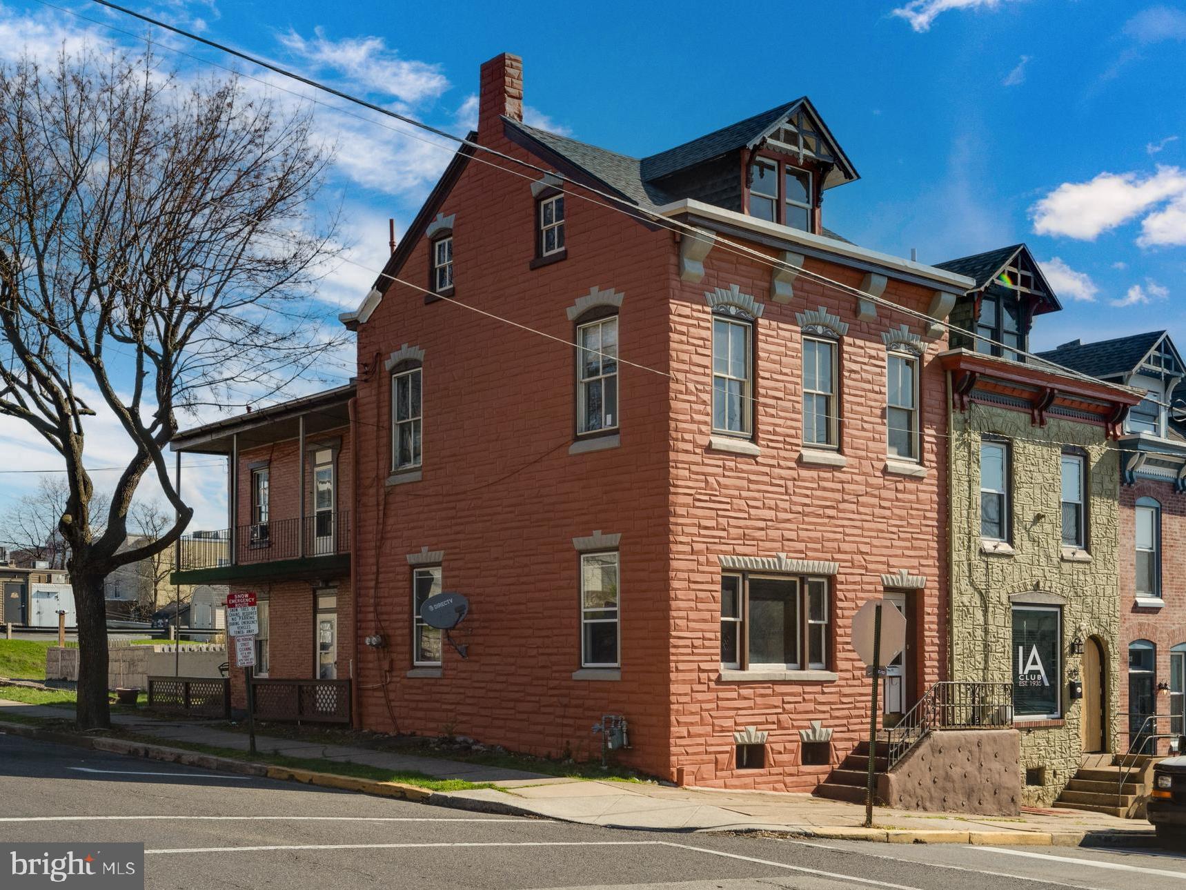 Calling all investors! If you are trying to build your portfolio in West Reading, this home is being sold below market value. With the home offering over 2,000 sq. ft. of living space and two full bathrooms, you do not want to miss out on this opportunity, located in the heart of West Reading, walking distance to the hospital, and easy on/off the highway for commuters. This 4-bedroom, 2 full bath, end of row offers a vestibule entry with original double doors with frosted glass and transom window to the grand staircase—all original woodworking. With a little sweat equity, this home can truly shine again! The main floor consists of a spacious living room and formal dining room with 9 ft ceilings, a 22-cabinet kitchen with access door to side porch, and a full bath with shower/tub! The second floor offers 4 bedrooms, 3 of them private, and a full bath with shower/tub. The third floor offers an unfinished 20x19 attic that can be finished or used for seasonal storage! Gas heat, corner lot, and two off-street parking spaces! Call now for more information or to schedule a private showing!