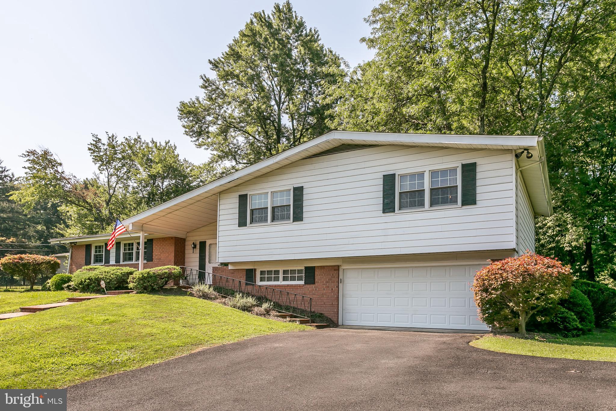 LOVELY CUSTOM BUILT SPLIT-LEVEL ON FABULOUS LOT. HARDWOOD AND PARQUET FLOORS THROUGHOUT.   FORMAL LIVING ROOM W/BRICKED WALL FIREPLACE - FORMAL DINING ROOM LEADS OUT TO COVERED DECK - EAT-IN KITCHEN - 1ST FLOOR DEN W/BUILT-INS - 3 GENEROUS SIZE BEDROOMS - MASTER BATH W/SHOWER AND DRESSING TABLE - ABUNDANT CLOSET SPACE THROUGHOUT -  STEP DOWN TO FAMILY ROOM AND OFFICE. 2 CAR GARAGE. CURB APPEAL IS A+.  PRICED TO SELL!