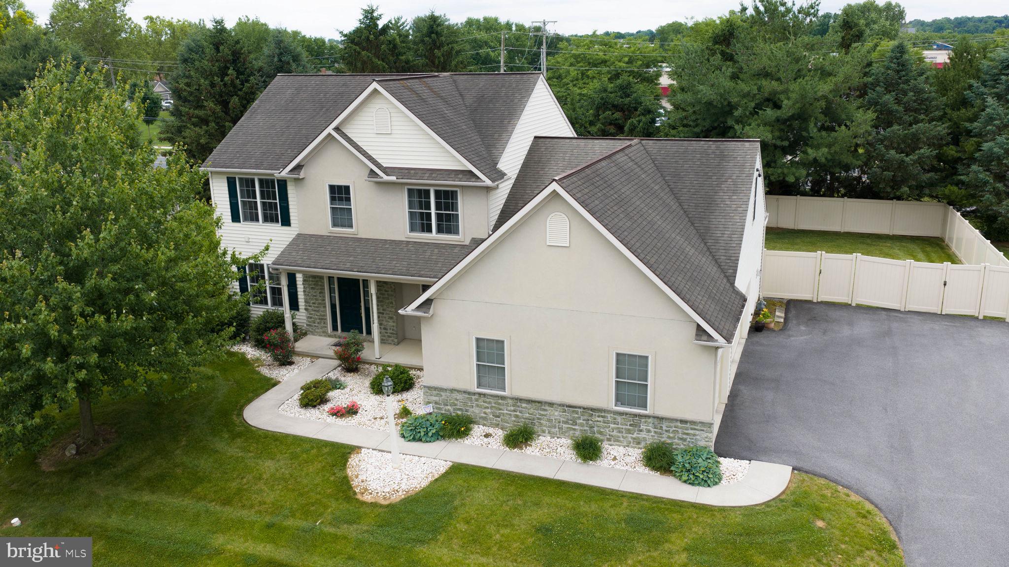 Don't miss this incredible opportunity to own this spacious 5-bedroom, 4.5 bath home, including 2 primary suites, one on 1st floor and one on 2nd floor.   Nicely appointed finished lower level with full bath, great for entertaining, game night or hosting guests.  The open kitchen features granite countertops with tiled backsplash and breakfast bar with seating. Enjoy your meals in an informal eating area open to the family room with built-ins and gas fireplace.  Additional private area adjacent to 1st floor primary bedroom with 2nd gas fireplace to unwind at the end of the day.  You can work from home in your 1st floor office area.  The 2nd floor features 4 spacious bedrooms including 2nd primary suite & 2 full baths.  There is an additional utility area in the lower level for extra storage and convenient walk out stairs to the large fenced in backyard area.  The patio has a retractable awning for your warm weather enjoyment.  Move-in ready in desirable Manheim Township School District.  This home has been lovingly maintained and upgraded throughout their ownership.  Electric car charger in garage is negotiable, whole house generator and security system is included.  Floor plans & room measurements are included in photos.