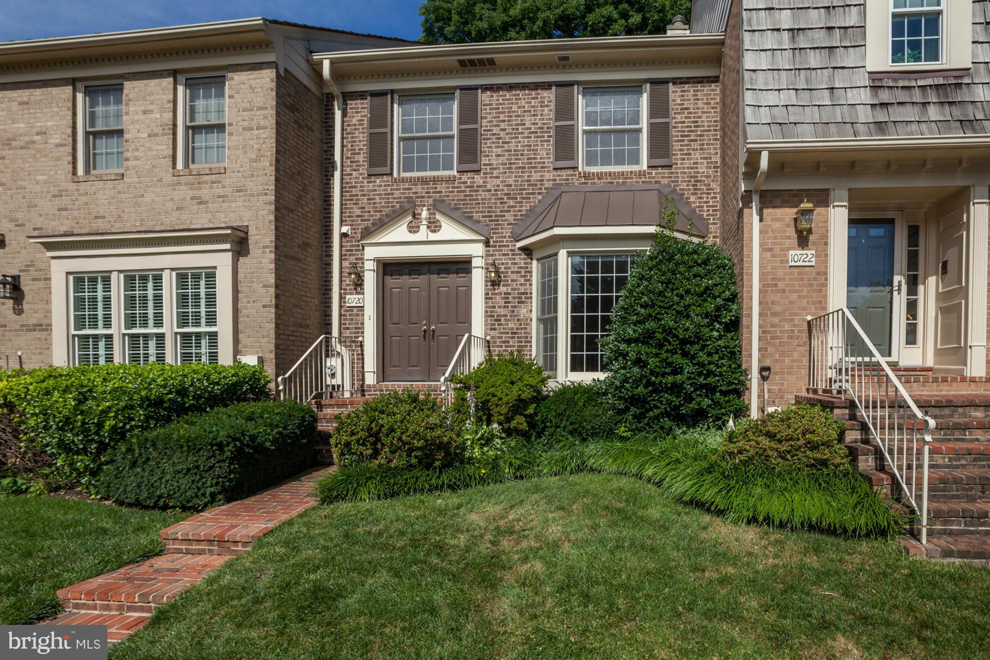 Beautiful all brick three level home backing to gorgeous wooded views! Light-filled open floor plan w/ hardwood floors & crown molding. Updated kitchen opens to family room w/ fireplace. Master Suite w/ loft and fireplace. Upper level laundry! Large walk-out lower level, storage room, 2 great decks, easy parking. Clubhouse, pool, tennis, trails and close to Grosvenor Metro, WJ schools. Don't miss!