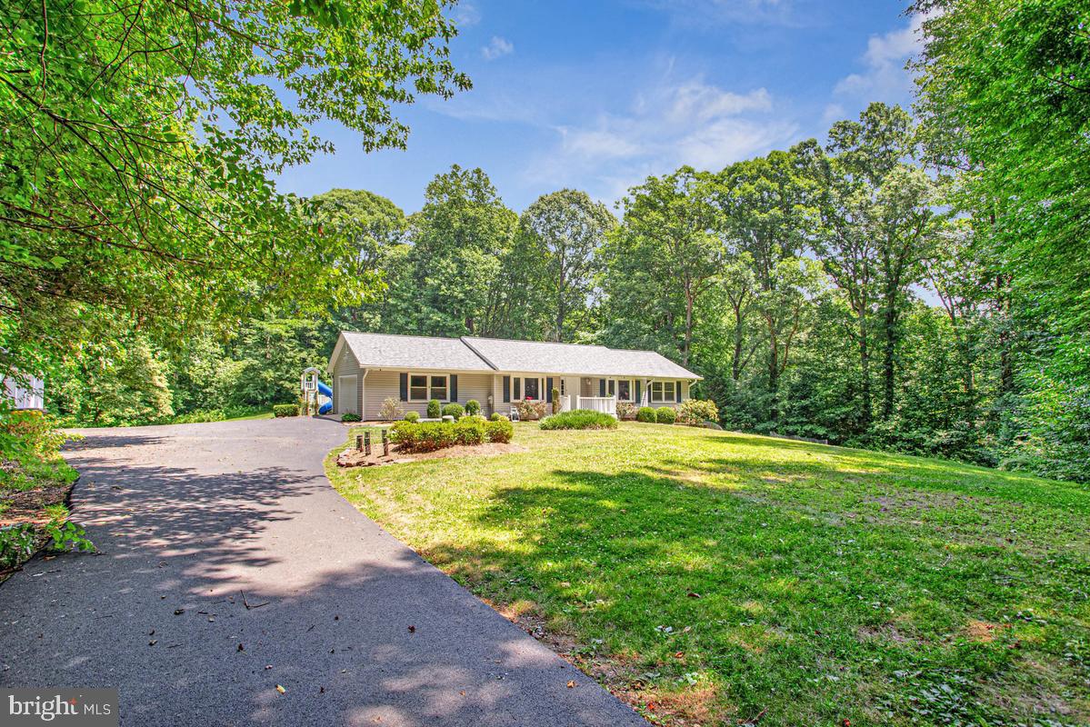 Your Private Oasis Awaits in Friendship!
Escape the hustle and bustle and step into your own private resort! Situated at the end of a long, over two acres and a private driveway with an abundance of parking and a 2-car garage, this stunning property offers unparalleled privacy and space.
The main level features a highly desirable layout with three spacious bedrooms, a dedicated home office/den perfect for remote work, a bright kitchen, and an inviting family room. Head downstairs to the fully finished walk-out basement, which offers excellent potential for an in-law suite or guest quarters, complete with an additional bedroom, full bath, laundry room, and a massive family/rec room.
But the real showstopper is the backyard. Designed for ultimate entertainment and relaxation, the massive yard features a spectacular custom pool with a cascading waterfall, a built-in playground, and a spacious deck. Even with all these premium features, there is still an abundance of green space left over for lawn games, pets, or hosting unforgettable summer gatherings.
Combining main-level convenience, a flexible lower level, and a backyard paradise, this home is a rare find in Friendship.