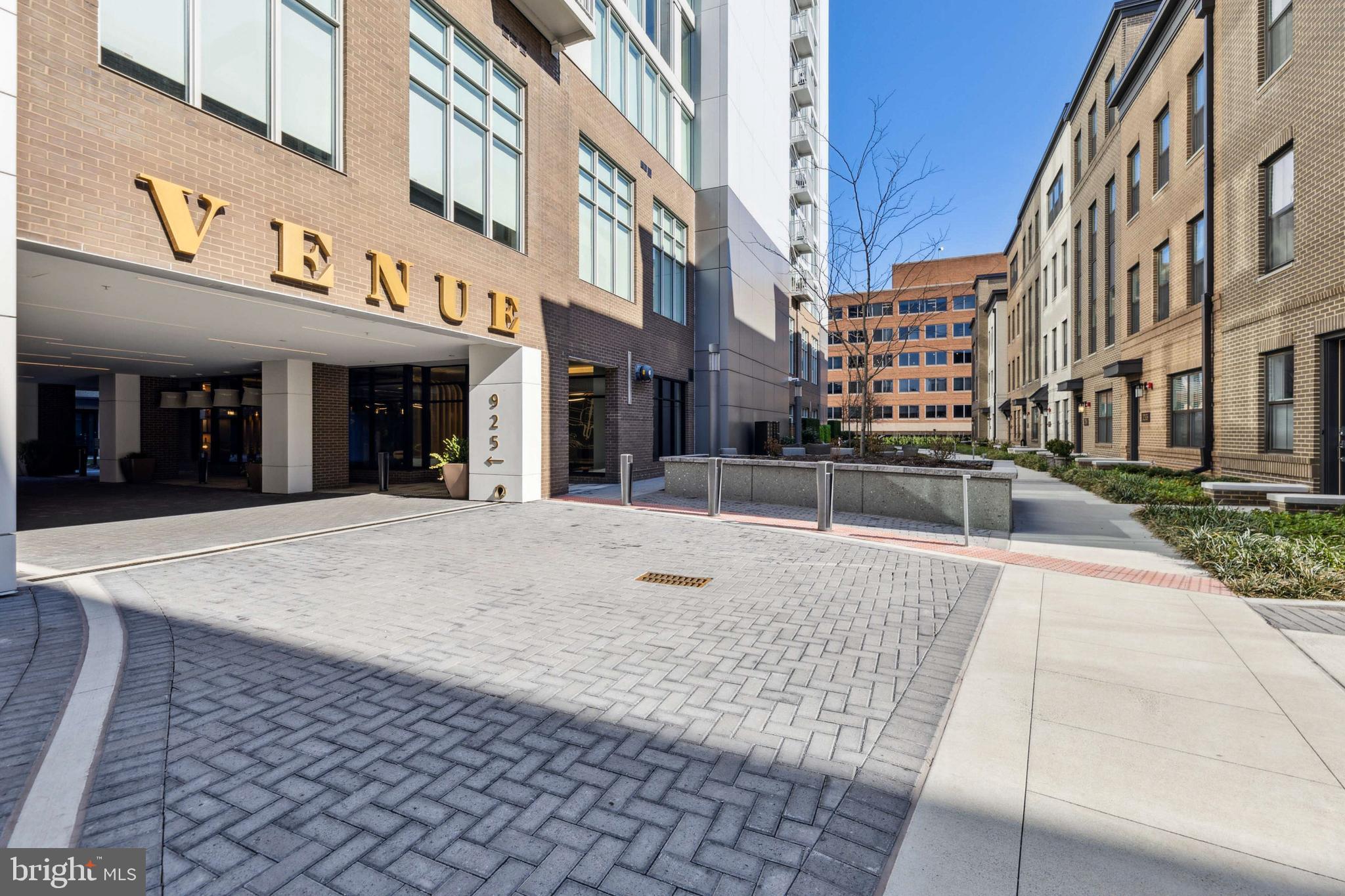 Introducing this exquisite 1-bedroom with den, 1.5-bathroom residence in The Venue, Old Town Alexandria's premier luxury condominium building, completed in 2022. This gorgeous unit boasts 985 sq ft of modern elegance with breathtaking water and city views. The floor-to-ceiling windows flood the space with natural light, enhancing the sense of openness and luxury. The thoughtful design ensures that every inch is utilized with purpose, providing a spacious and inviting atmosphere. The kitchen is a chef's dream, featuring Bosch appliances, Quartz countertops, and custom cabinetry. With a focus on both aesthetics and functionality, the residence offers recessed lighting throughout, adding a touch of warmth to the contemporary design. As a resident of The Venue, you'll enjoy a turn-key elevated lifestyle. Enter through the hotel-style Porte-Cochere into the Grand Lobby, where a Full-Service Concierge and on-site building manager await to cater to your every need. The building offers a sprawling Rooftop Terrace with panoramic views of the DC Monuments, Potomac River, National Harbor, and Old Town skyline. The terrace also features an outdoor grilling station and fire pit seating area for your enjoyment. Indulge in the elegant indoor Owner's Sky-Lounge, equipped with flat-screen TVs, a fireplace, and a cocktail bar – an ideal space for entertaining guests. For the health-conscious, the state-of-the-art Fitness center includes a Barre studio to cater to your wellness needs. You'll also have access to the state of the art theater, tennis courts and dog park, for your furry friends. The Venue is ideally situated in the heart of Old Town North, providing direct access to the Mount Vernon Trail. Immerse yourself in the center of entertainment, restaurants, and shopping, making this residence a must-see for those seeking the epitome of sophisticated living in Old Town Alexandria.