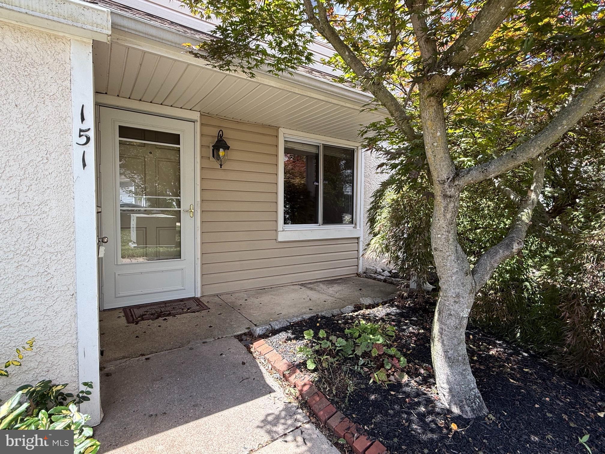 Welcome to this well-maintained end-unit townhome in the desirable Caines Creek community. Ideally situated on the outskirts of Phoenixville Borough, this home offers the perfect combination of low-maintenance living and convenient access to everything the area has to offer. Enjoy being just minutes from vibrant downtown Phoenixville's restaurants, shops, parks, and entertainment, while also benefiting from easy access to major commuter routes leading to Malvern and King of Prussia. Inside, you'll find a home full of character and potential, ready for its next owners to make it their own. The main level features an open and inviting living room and dining area, creating a comfortable space for everyday living and entertaining. The living room includes a hookup for a wood stove, offering the opportunity to add warmth and charm during the colder months. The updated kitchen boasts newer cabinetry, attractive countertops, and ample workspace for meal preparation. Durable vinyl plank flooring runs throughout the main level, while a convenient laundry closet and powder room complete the first floor.
Step outside to a spacious paver patio overlooking a large open green space, providing a peaceful setting for outdoor dining, and simply relaxing. Upstairs, you'll find three comfortable bedrooms and a full hall bathroom. The entire home has been freshly painted and features brand-new carpeting on the second floor, making it move-in ready. Custom woodwork throughout the home. One of the greatest benefits of Caines Creek is its easy, low-maintenance lifestyle. The condominium association covers exterior building maintenance, lawn care, landscaping, and common area upkeep, allowing you to spend less time on chores and more time enjoying your home. Residents also have access to community amenities including a swimming pool and clubhouse—perfect for enjoying the summer months. 2 Assigned parking spaces. With its excellent location, community amenities, low-maintenance ownership, and availability for a quick closing, this is a wonderful opportunity to enjoy comfortable living near all that Phoenixville has to offer.