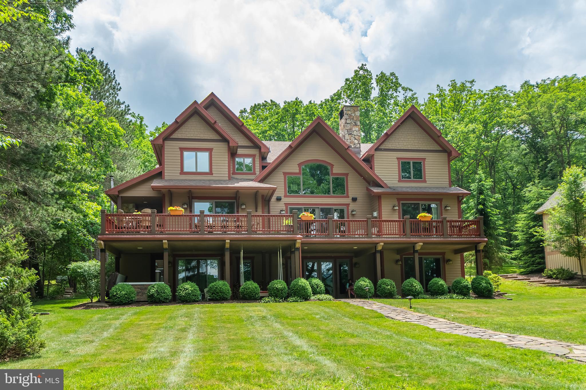 Lakefront gem boasting over 100' of lakefront for your enjoyment.  This fractional ownership home offers five bedrooms, three levels of living space, a spacious great room, granite counters and hardwood flooring. The 1/7 ownership lets you enjoy a stunning lakefront home at a fraction of the cost. The maintenance is all taken care of, the only headache you have is what to pack.  The location is just minutes to Wisp Ski Resort, shopping, grocery stores and the cinema.
