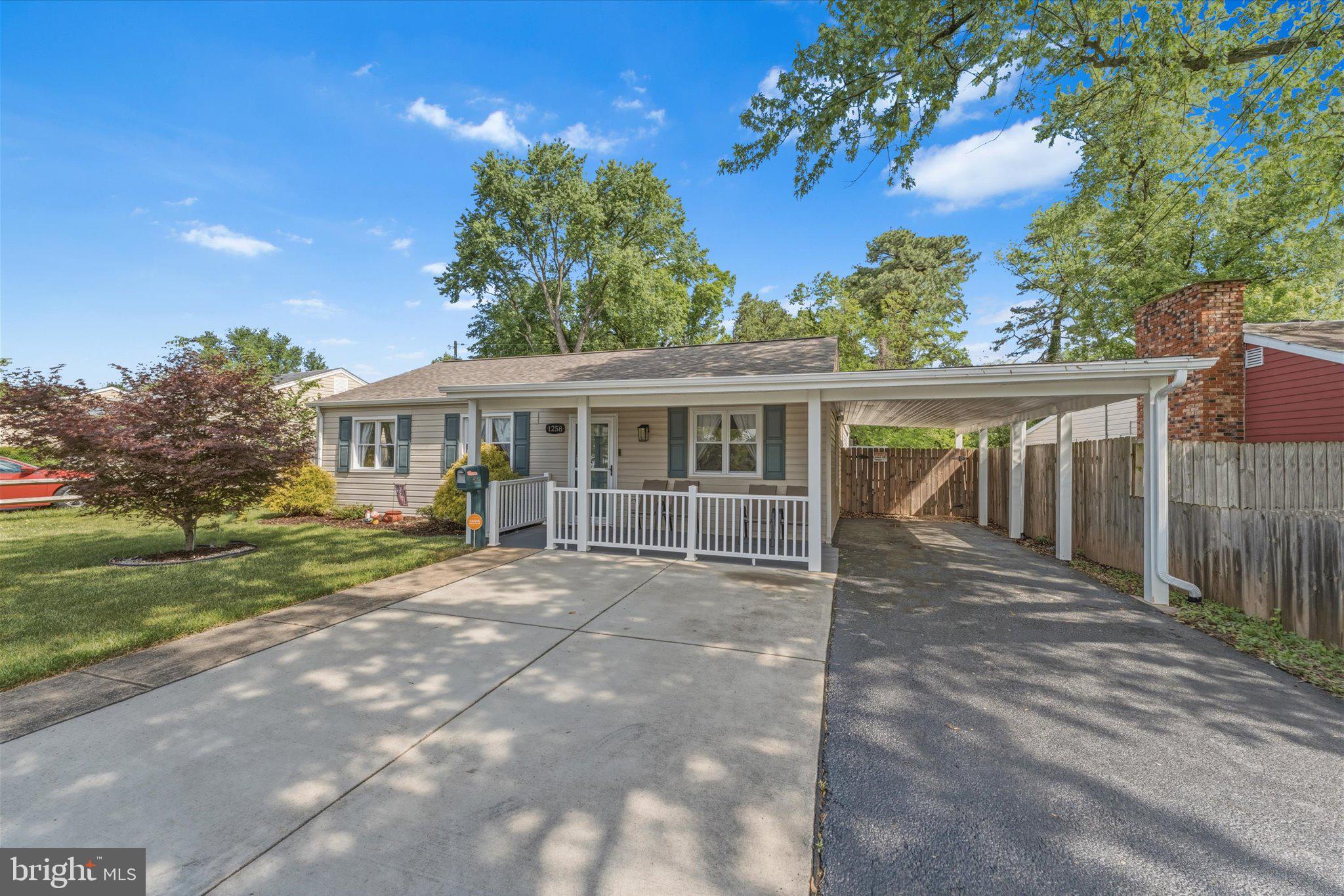 Discover unexpected space and effortless living at 1258 Guildford Rd! This rancher offers everything today's buyers seek in a 2026 market: affordable single-level living, modern updates, generous gathering spaces, and a private backyard gem. Step inside to find the traditional rancher exterior hides over 1,600 square feet of main-level living.  A large living room flows into an updated, modern kitchen with a massive kitchen/dining area—perfect for everyday meals, homework sessions, or hosting friends. The four-season heated sunroom extends your living space year-round, creating a bright, versatile spot for relaxation, play, or a home office. A primary suite plus two additional bedrooms and a second full bath provide comfortable space for everyone. Outside, enjoy a covered front porch for welcoming neighbors, off-street parking with a carport, and a large fenced rear yard which includes an apple and a plum tree and that backs to wooded natural park space. It's a private haven that's exactly what dog lovers and homeowners crave in Glen Burnie. In a market where buyers prioritize updated homes with practical layouts, low-maintenance appeal, and proximity to commuting routes, schools, and amenities, this home stands out. It's surprisingly roomy inside, move-in ready, and perfectly suited for comfortable, convenient  living. Don't miss this rare opportunity!  VALUE ADDING UPDATES: HVAC 2025, ROOF 2025, WINDOWS  6 YRS OLD. Schedule your showing today.