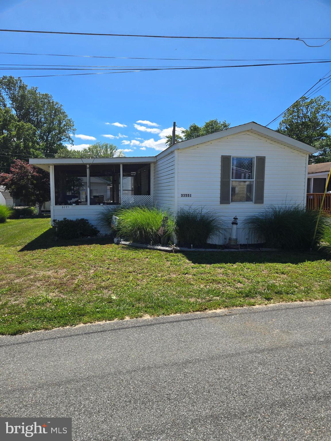 Come see this beauty in a small park with affordable land lease and move in ready. This mobile home offers a comfortable 2 bedroom and 2 full baths with a private bath in the primary bedroom.  The home was bought new by the owners and has been kept in great condition even adding a main shutoff valve inside the laundry room so no crawling under the house to shut the water off.  Offers a nice shed with a workbench and outside storage for the beach chairs.  The community sets and yes, I am saying it (close to the resorts) but has plenty of shopping just across the street.  You can also access the resorts from many different routes and avoid the heavy traffic on the main roads. The rent takes care of everything except utilities (see documents for specific details.  These homes don't hit the public market very often so if you're looking for that affordable beach home or just a quiet get a way this may fit your goals.  Park approval is required before any offer will be submitted and there is an application on file. Furniture could be included with acceptable offer. Personal items including one small bed not included.