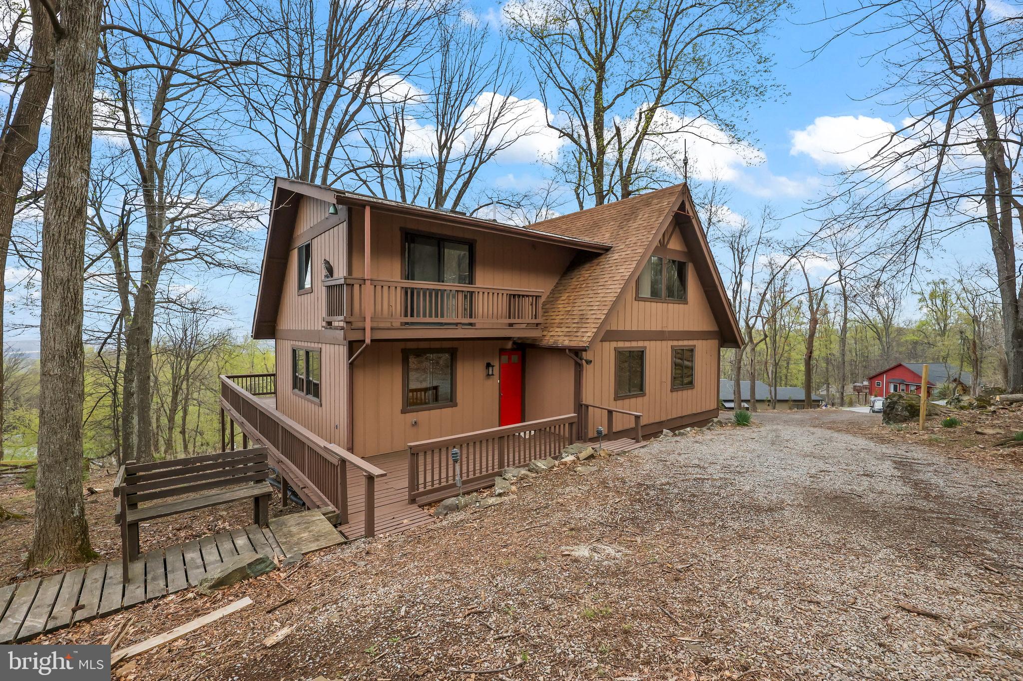 Welcome to 758 Club House Rd in scenic Front Royal, VA—where comfort meets natural beauty. This thoughtfully updated home is perfectly positioned to enjoy stunning views and the peaceful surroundings of the Blue Ridge foothills. Step onto the spacious deck or unwind on the private balcony off the primary bedroom, both ideal for taking in the tranquil setting. Inside, you'll find reconditioned wood floors, fresh paint throughout the interior and exterior, and a recently upgraded central heating and air system that enhances comfort year-round.

Located in a vibrant community that offers a range of amenities, including a swimming pool, tennis courts, community spaces, and access to scenic hiking paths, this property invites an active lifestyle. Nature lovers will appreciate the close proximity to the Appalachian Trail, while commuters benefit from easy access to I-66. Whether you're seeking a serene retreat or a well-connected home base, this property blends charm, functionality, and location in one exceptional package.