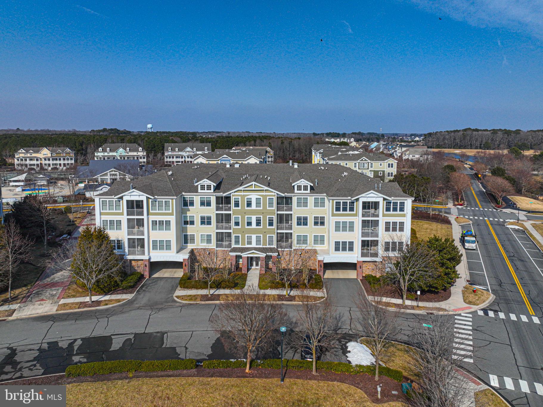 Located in the premier community of Bayside, this top‑floor condo offers effortless one‑level living with 2 bedrooms, a den, and 2 full baths. The open living, dining, and kitchen layout creates an easy flow, while the split‑bedroom design provides privacy for you and your guests. The den features a stylish barn door, making it a great flexible space for work or overflow sleeping. Additional highlights include engineered hardwood flooring and a screened porch perfect for catching the coastal breeze.

Just steps away, you’ll find the popular Sun Ridge Recreation Center, and the condo also includes a conveniently located, locked storage unit on the same floor—ideal for all your beach gear.

Bayside is known for its exceptional lifestyle and amenities, including indoor and outdoor pools, the Aquatic Center, the Signature Clubhouse , on‑site dining, a private beach, and a full calendar of events, concerts, and activities year‑round. It’s an award‑winning community where every day feels like a getaway.

Come see this condo before it’s gone.