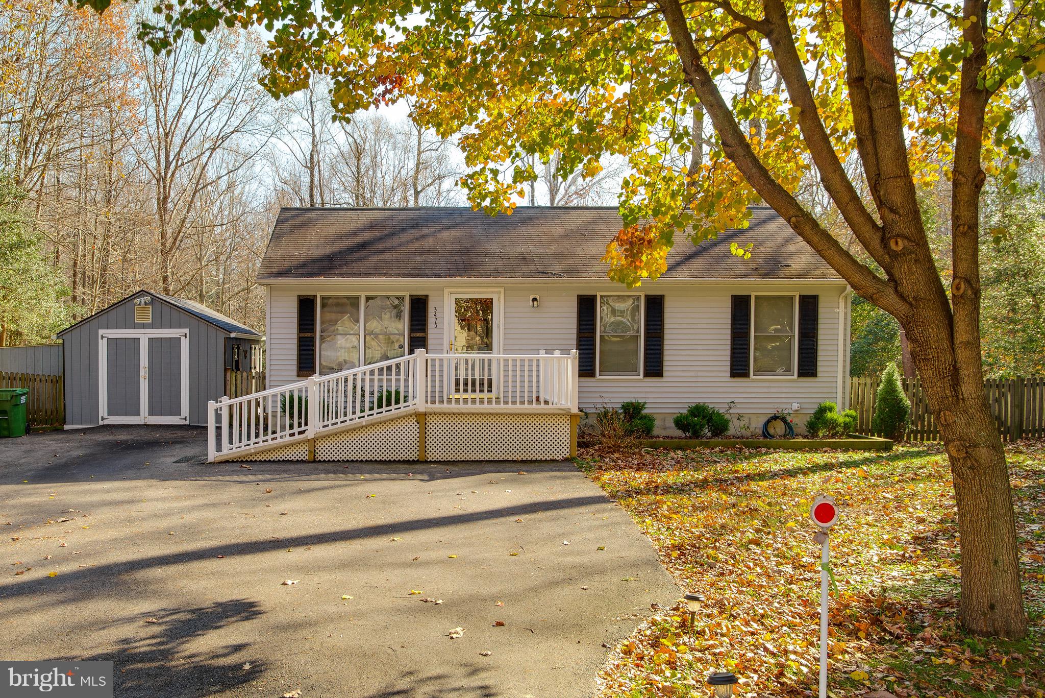 Charming rambler -exceptionally well maintained, freshly painted, including  updates and easy-to-maintain finishes.  The efficient, eat-in kitchen invites lingering and cozy chats.  Enjoy your coffee or dinner on the deck overlooking the fenced back yard backing to preserve area.  The entry leads to the open living area, and the bedrooms are just down the hall.  Three bedrooms, all with carpet and updated paint, share the nicely sized  bathroom with large linen closet.  Outside, two sheds provide storage for yard  equipment and tools- or potential for your man cave/she shed space!  Easy commute to Joint Base Andrews and PAX River!