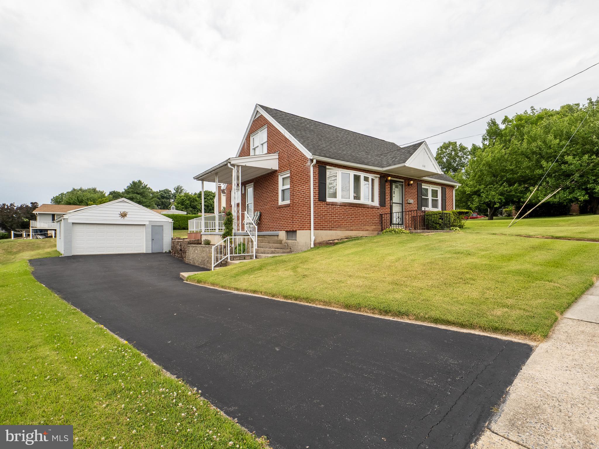 This charming, well-cared-for all-brick Cape Cod is located in the Governor Mifflin School District. Featuring 4 bedrooms and situated on nearly a 1/4-acre lot, this home offers plenty of potential both inside and out. Yes, there is gas heat and central air conditioning. The lower level includes a finished area, along with a separate small workshop. Outside, you'll find a large detached garage, a covered side porch, and a covered rear deck that are perfect for relaxing or entertaining. With its attractive curb appeal, solid construction, and evident pride of ownership throughout, this home delivers tremendous value at an affordable price.