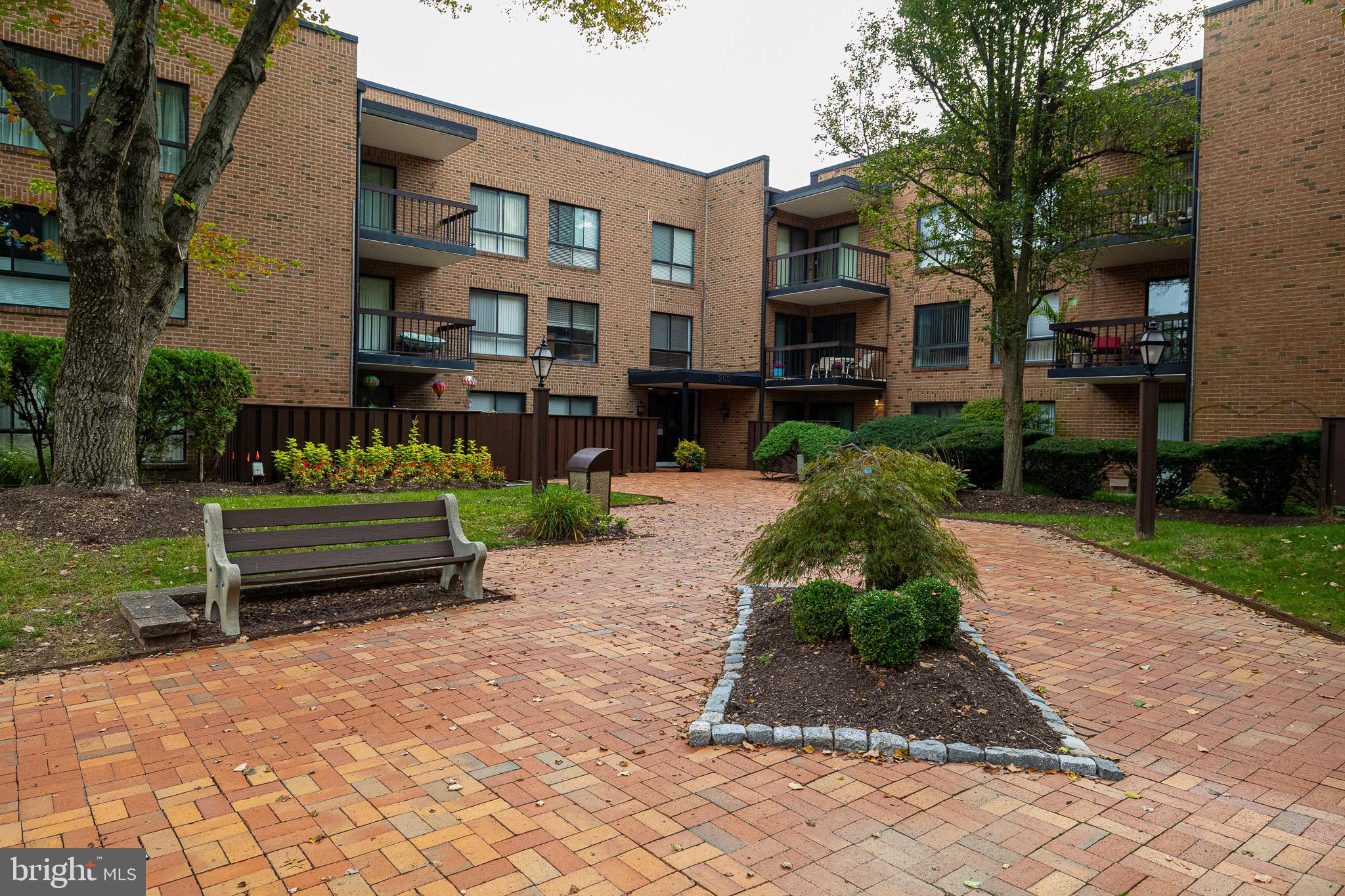 Welcome to effortless living at Hill House, one of Huntingdon Valley’s most sought-after low-maintenance communities! This spacious 2 bedroom, 2 bathroom condo offers a perfect blend of comfort and convenience. Step inside the secured building where the main entrance located on the second floor leads you right to your unit with no stairs to climb. A welcoming foyer with coat and utility closets sets the tone. The eat-in kitchen features crisp white cabinets and upgraded stainless steel appliances. The bright and airy living/dining room is ideal for entertaining, with oversized windows flooding the space with natural light and offering serene views. A sliding glass door leads to your private balcony—the perfect spot to enjoy your morning coffee or unwind with a good book. The primary suite includes a large walk-in closet and a full bath with a tub/shower combo. A second bedroom with its own bathroom and stall shower is perfect for guests or a home office. Additional conveniences include in-unit laundry with top-of-the-line washer/dryer and a dedicated basement storage area. Residents enjoy beautiful landscaped common areas, peace of mind with secure entry, and a prime location—minutes from shopping, dining, public transportation, and local parks. Holy Redeemer Hospital and associated medical offices are also right next door. Make your appointment today!