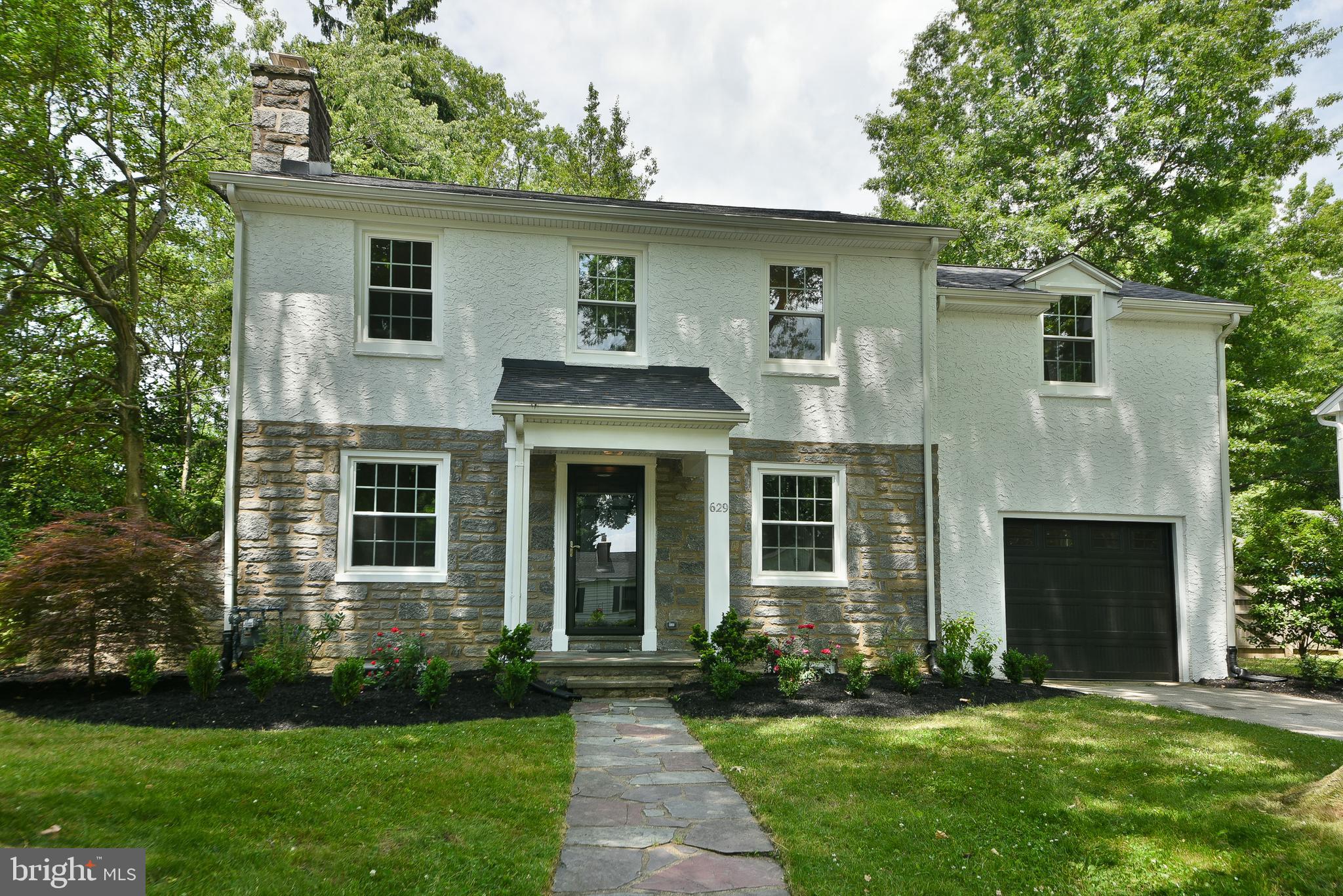 Welcome to 629 University Place, an extensively renovated Colonial situated on one of Swarthmore's most picturesque and quintessential tree-lined streets. Just a short walk to downtown Swarthmore, the train station, and the beautiful campus of Swarthmore College, this exceptional home offers the rare combination of timeless character, modern amenities, and an unbeatable walk-to-town lifestyle. Thoughtfully reimagined from top to bottom, the home blends historic charm with the comfort and peace of mind of modern living. Extensive improvements include a brand-new roof, all new OKNA 800 Series windows, a new insulated garage door, new HVAC system, new hot water heater, conversion from oil to natural gas, a complete electrical rewire, new plumbing serving the kitchen and bathrooms, and a new plumbing stack. Fresh interior and exterior paint and new ¾-inch solid oak hardwood flooring throughout complete the transformation.
Inside, abundant natural light highlights the home's original character and fills the inviting living spaces. At the heart of the home is a stunning new kitchen featuring an open, spacious layout designed for entertaining and everyday living. All bathrooms have been fully renovated, including the transformation of a former half bath into a full en-suite bath, creating a desirable primary suite rarely found in homes of this era. The second floor offers three generously sized bedrooms, including the primary suite, along with a versatile bonus room that is ideal for a home office, nursery, reading room, or creative space. This flexible layout provides options to fit a variety of lifestyles and needs. The spacious living and dining areas retain the warmth and character that make Swarthmore's historic homes so special. The living room features a fully functional wood-burning fireplace enhanced by a new HeatShield chimney lining. Adding to the home's charm is a beautifully rebuilt three-season sunroom featuring new framing, insulation, and Eze-Breeze windows. Overlooking the backyard, this bright and comfortable space is ideal for relaxing, entertaining, or enjoying the changing seasons. The basement has been professionally improved with waterproofing, including a new partial French drain system, new sump pit and sump pump, and newly finished stucco walls. Clean, dry, and ready for storage, recreation, or future finishing, the basement offers exceptional flexibility.  Outside, newly completed landscaping, backyard grading, and fresh grass seed provide a welcoming setting for outdoor enjoyment and entertaining. Whether you're strolling into town for dinner, catching the train, enjoying the shops and restaurants of downtown Swarthmore, or taking a walk through the campus of Swarthmore College, you'll appreciate the unique lifestyle this location provides. Combining classic character with extensive modernization, 629 University Place is a truly turnkey home where the hard work has already been done.
Owner is a licensed PA Realtor.