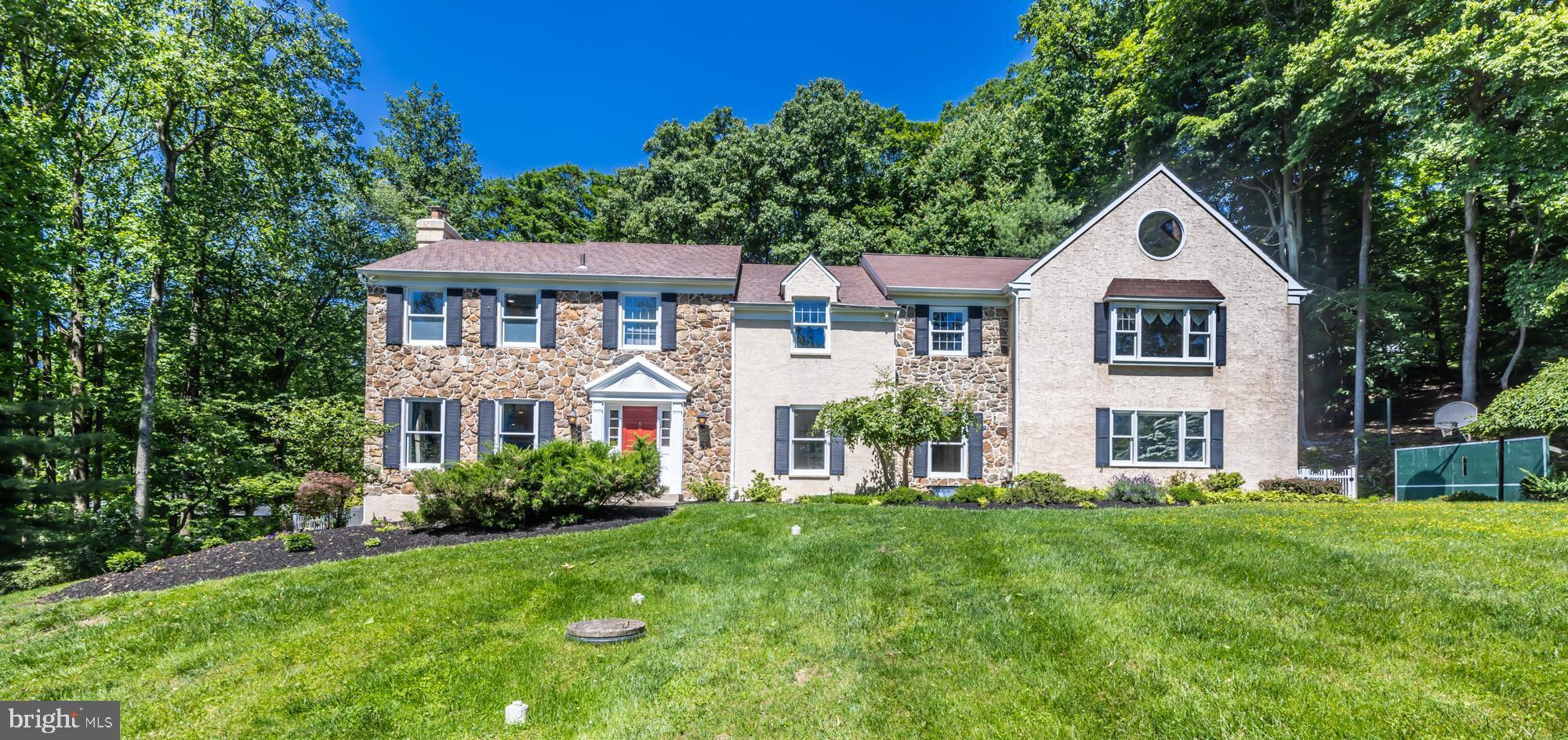 Ideally located on 2.3 acres in Tredyffrin Township, this 5 bedroom 4 bath Colonial home provides you the perfect retreat.  The foyer welcomes you into the home with a spacious light filled dining room on the one side and a formal living room with a comfortable wood burning fireplace on the other.  Through the living room, enter the office with built in bookshelves and double doors which lead to the newly updated Trex deck and hot tub.  In the heart of the home is the stunning updated kitchen with an open concept floor plan including the breakfast room, family room with stone fireplace plus views of the yard and surrounding woods.  The kitchen will WOW you with its gorgeous 14’ center island, quartz counter tops, built in wine fridge, Sub-Zero fridge, and stainless-steel appliances.  Completing the first floor is the laundry room, with access to the garage, and powder room.  Hardwood floors throughout, with tile in foyer.  Head upstairs and check out the master bedroom with a custom built closet, additional linen closet and a Juliet balcony.  The en-suite bathroom was renovated in 2022 with all the bells and whistles including a soaker tub, glass enclosed tile shower, patterned tile floor with radiant heat on all floors (yes, even in the shower), towel warmer, quartz counter tops, sound system and top of the line fixtures.  There are four additional bedrooms and a hall bathroom on this level as well as a 29x24 Great Room, which could be used for a family room, playroom or office.  The finished basement includes a family room area with built in cabinets, an additional room which could be used as an office, craft room or bedroom, a full-sized bathroom, a workshop, and access to the outside. Step outside to your own backyard oasis and enjoy all the comforts of your beautiful in ground pool, hot tub and putting green surrounded by mature trees and greenery, a flagstone patio and Trex deck (plus a sound system). Home freshly painted, new carpets in basement and second floor. Equipped with SMART features and partial house generator. Easy access to 202, Turnpike, I-76, Valley Forge National Park, shopping and Chesterbrook and Great Valley Corporate Centers.  Professional photos will be added by May 30th.