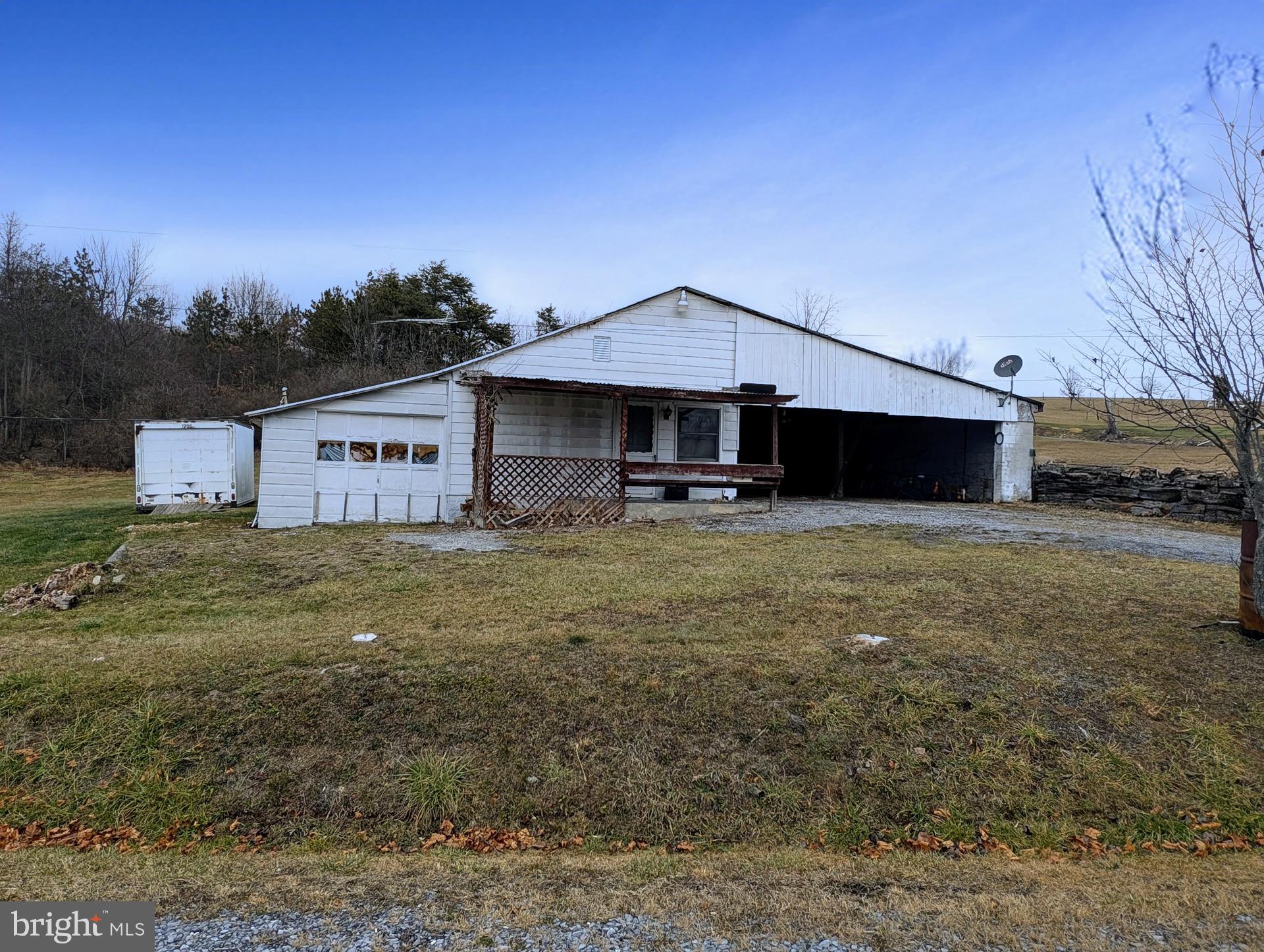Ideally situated on Country Ridge Road, this 1.03 acre lot presents a unique chance to create your dream home. Either renovate and expand the existing single-wide residence or clear the land and build a new home tailored to your preferences. The property's flat terrain and scenic views are complemented by a well, septic system, and electricity already on site. With its convenient location off Route 30, you'll be within easy reach of lakes, trails, hunting, major highways, and local amenities. Property has been winterized.