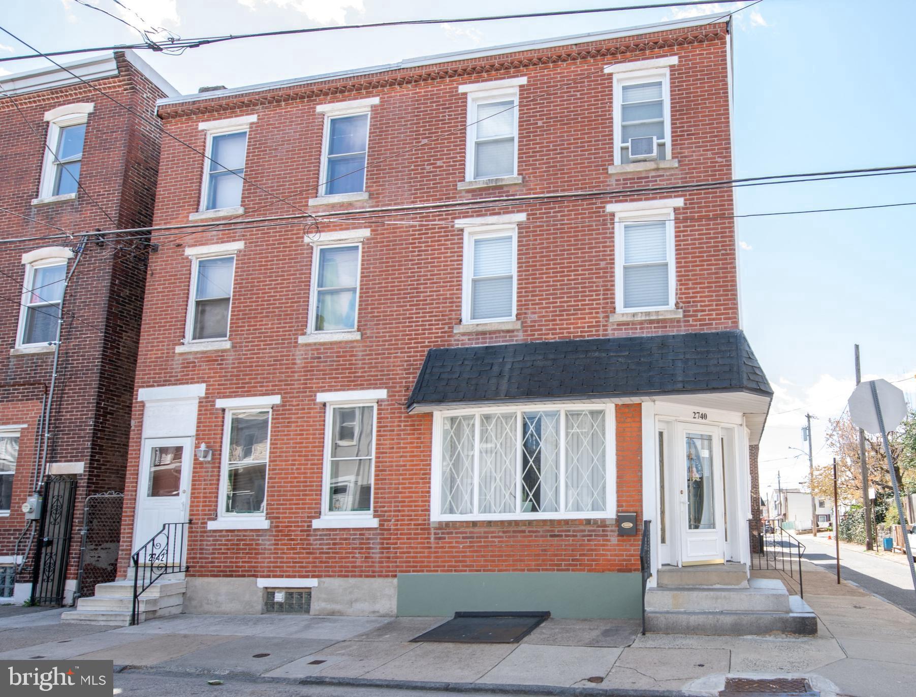 Welcome to 2740 Pratt Street located in the heart of Bridesburg.  
This five-bedroom, one and a half-bath end-of-row home sits on a corner lot with classic brick-front charm.  As you step inside the home, you're welcomed into a bright family room with a decorative fireplace that then flows into a spacious living room. An eat-in kitchen featuring abundant cabinet space and room for dining is also located on the first floor.  An entrance-exit door from the kitchen leads to the outside and  just a few steps away to an outside bathroom and also a side access to the garage. (Please note: this outside bathroom on listing is listed as the half bath on main level)   Upstairs, the second-floor hosts three well-sized bedrooms, a bonus room which offers flexibility- ideal for a home office, nursery, or additional storage and there is also a full hall bath with tub/shower. The third level features a large primary bedroom, offering privacy and a quiet retreat and one additional smaller bedroom ideal for a nursery on the same floor as the primary bedroom. 
(5 bedrooms plus bonus room in all) The unfinished basement is where you will find the laundry area featuring a washer and dryer and a bonus shower area. (behind the curtain)  There is a detached one-car garage that features a walk-up loft and workshop area adding value - great for hobbyists or extra storage. While the home does need some updating, the layout, square footage, and the unique features make it a great opportunity in this neighborhood.  Close to schools, shopping, I-95, and public transportation. Schedule your appointment today to take a look.