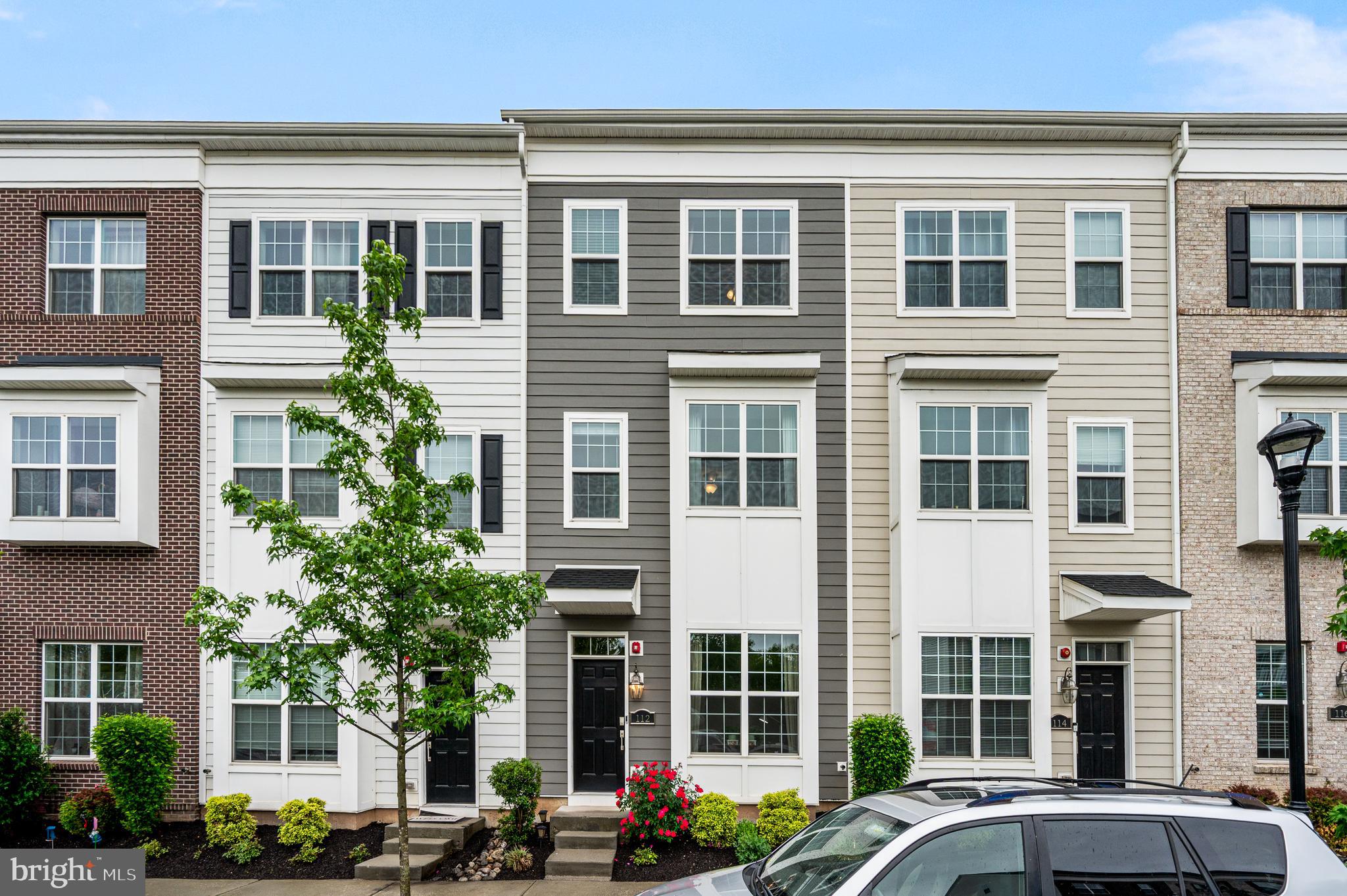 Tucked into one of Waterside's quiet open-space-facing locations and just steps from the river, this northeast oriented 3-bedroom, 3.5-bath townhome offers four stories of light, two private balconies, and a layout that has been thoughtfully upgraded. The original loft was enclosed to create a true second primary suite with its own full bath—so the home now offers two ensuite bedrooms, plus a third bedroom served by a full hall bath. Built recently and meticulously cared for, it shows like new throughout. Outside the door, the community's walking paths wind along the waterfront to a tot lot and a much-loved on-site café. The HOA handles lawn care, snow removal, trash, and common areas, leaving weekends free. Pristine condition, two ensuites, two balconies, and one of the better vantage points in the neighborhood. Please note, some photos are virtually staged.