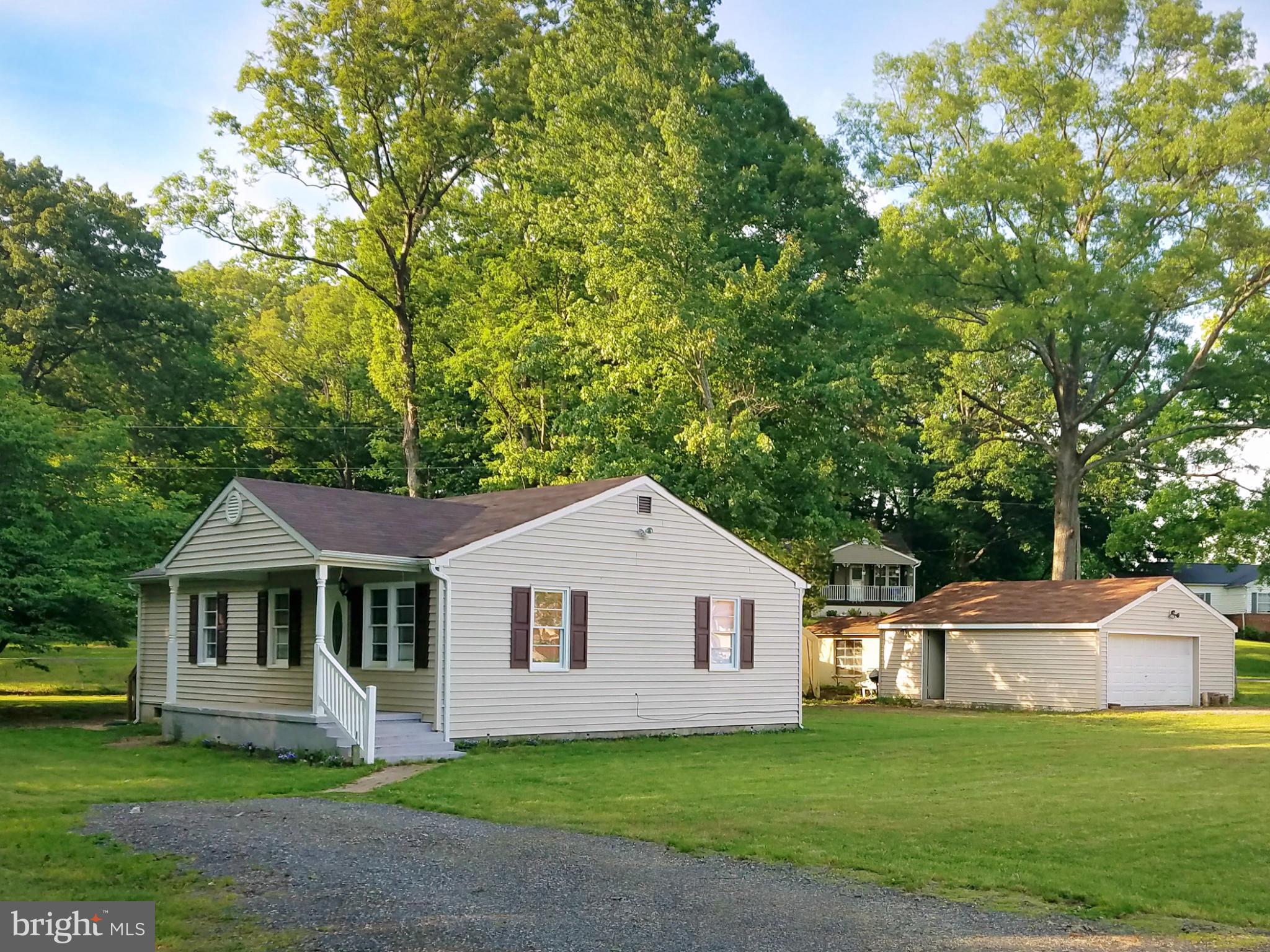 Gorgeous Renovated Home! One level living on almost half of an acre! 3 bedrooms, 1 bathroom & 2 CAR DETACHED GARAGE (24' x 24') w/ electric & second driveway.  Updates throughout, new kitchen cabinets, stainless steel appliances, freshly painted, newer flooring, ceramic tile, new well, new septic, new HVAC, front load washer & dryer & more! NO HOA! 100% Financing USDA-RD eligible!