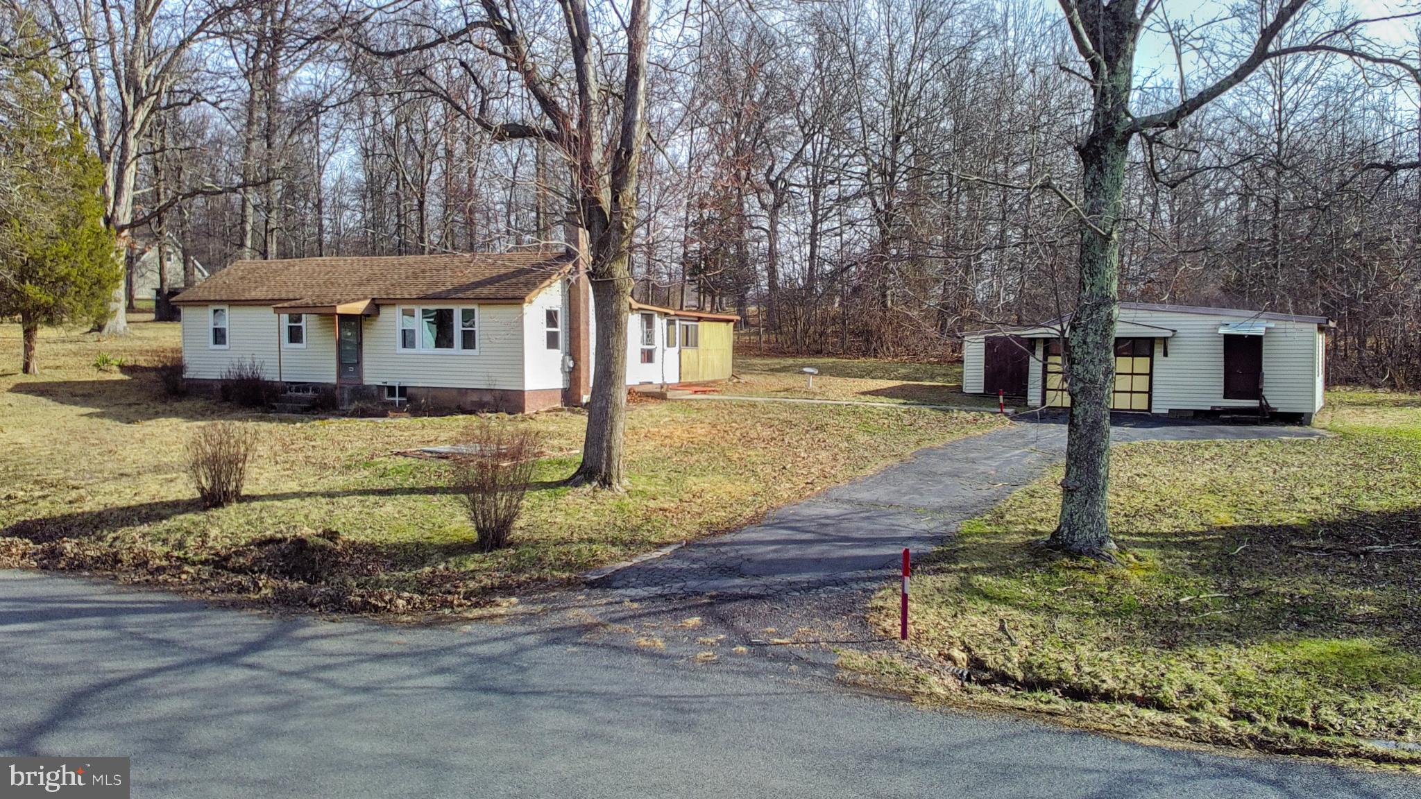 Incredible investment or development opportunity! This sale includes two parcels (Tax IDs 42-008-031 and 42-008-029-001) offering a combined total of over 2.16 acres of tranquil, rural land. (Please note: Taxes listed reflect both parcels combined).

The property features a classic 3-bedroom, 1-bathroom ranch home built in 1943 with heavy-lifting upgrades already completed: all-new windows throughout the entire house (with transferable warranty!), a new oil tank, and a newly installed electrical panel. Inside, a full basement and an enclosed patio provide ample space for expansion or renovation. Outside, the expansive lot features outbuildings perfect for storage or workshops.

Whether you are an investor seeking a property with huge growth potential, or a buyer looking to capitalize on the demand for rural residences with room to build, this location offers the perfect balance of a peaceful environment that is still easily accessible to nearby amenities. Don't miss out on this unique, land-rich opportunity!