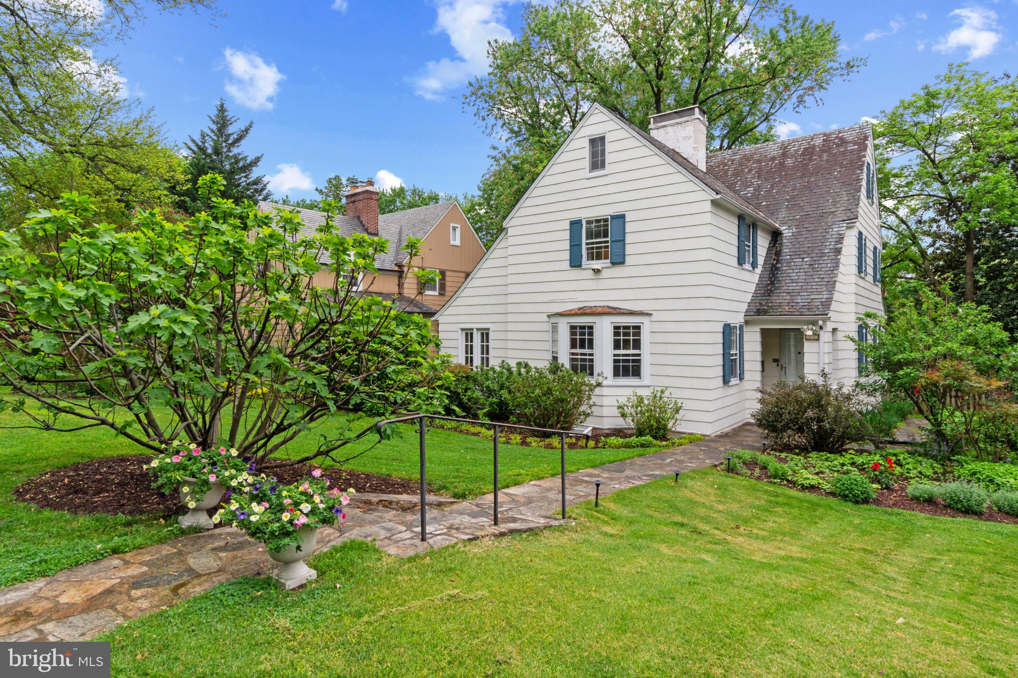 Storybook Charm Meets Modern Comfort in the Heart of Homeland

Welcome to this spacious and sun-drenched storybook home nestled in the highly sought-after Homeland neighborhood. From the moment you step into the gracious foyer, you'll be drawn in by the warmth, character, and generous proportions throughout.

The main level offers expansive living spaces perfect for everyday living and entertaining. A large formal living room features a working wood-burning fireplace and opens to a stunning sunroom with floor-to-ceiling windows and access to a private stone patio—your serene escape just steps away. The elegant dining room showcases original built-ins, while the oversized kitchen is a true gathering space with a breakfast nook, center island, extensive cabinetry, and access to a spacious rear deck.

Upstairs, the light-filled primary suite boasts three closets and a private full bath. Two additional bedrooms share a well-appointed full hall bath. The third floor offers a private fourth bedroom with its own full bath and generous closet space—ideal for guests, a home office, or studio.

The lower level provides ample storage, a potential fifth bedroom or den with a cozy wood stove, and a convenient half bath. The beautifully landscaped yard is fully fenced and leads to a detached two-car garage.

Enjoy the lifestyle that Homeland offers—tree-lined streets, strong community spirit, and unbeatable convenience. Just minutes from top private and public schools, Loyola and Notre Dame universities, local shops, cafes, parks, and major commuter routes, this location provides seamless access to everything Baltimore has to offer.