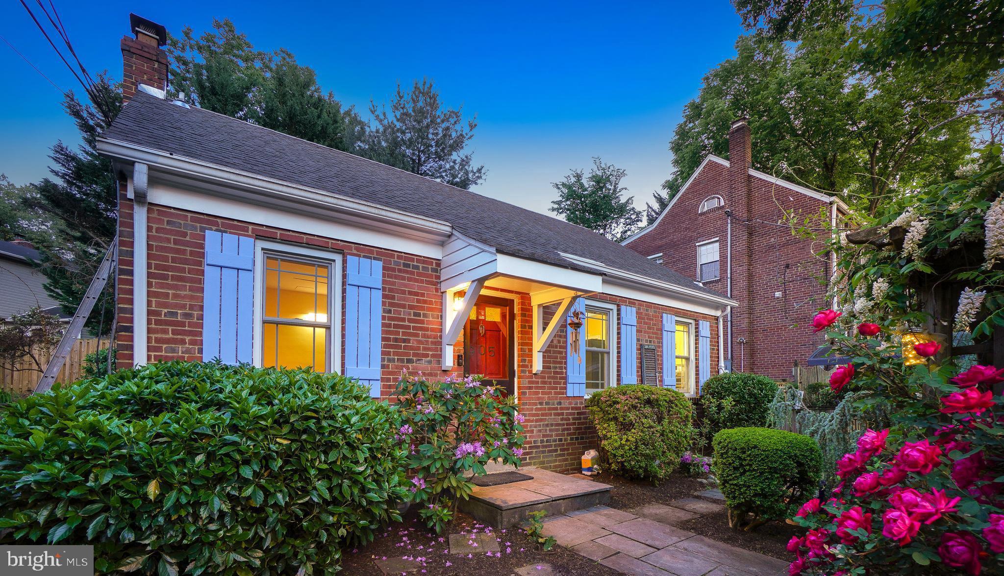 Welcome! To this sweet and charming cottage located between both Sligo Creek and Long Branch Parks. Set on a pleasant knoll and featuring stone pathways and patio spaces, you'll find comfort here. 

Upon arrival, you’ll notice the modern steel sloped cantilever carport and a front garden trellis.  The convenient driveway and a canopied steel carport features a Level 1 EV charger.  A warm, open living room with a ceiling fan flows into the kitchen. The kitchen features granite countertops, gas cooking, a pantry, and a corner China cabinet with glass doors. The home features replacement windows throughout. There are two bedrooms and a full bathroom on this level. The first bedroom includes a ceiling fan and built-ins. The second bedroom also has a ceiling fan and glass doors that open to the inviting patio.

Upstairs is the primary bedroom retreat with a unique bathroom, featuring a clawfoot tub with a floor-mounted faucet. The primary suite is sunlit, with four skylights with custom blinds, two access points to eaves storage, and wood flooring.

The basement is accessed from the side yard, and could be reconfigured for interior access - though currently the lower level may be used as an in-law suite, with its own separate entrance, and includes a living space with a kitchenette, stackable washer and dryer, and an updated full bathroom.

Outside are lush front gardens, an expansive flagstone patio, a fenced backyard with a shed, and a Japanese maple. 

Relish the warm sense of community as well as easy access to local shopping, restaurants, entertainment, Sligo Creek Trail, and Long Branch Trail providing both comfort and convenience in an ideal setting. See you there!