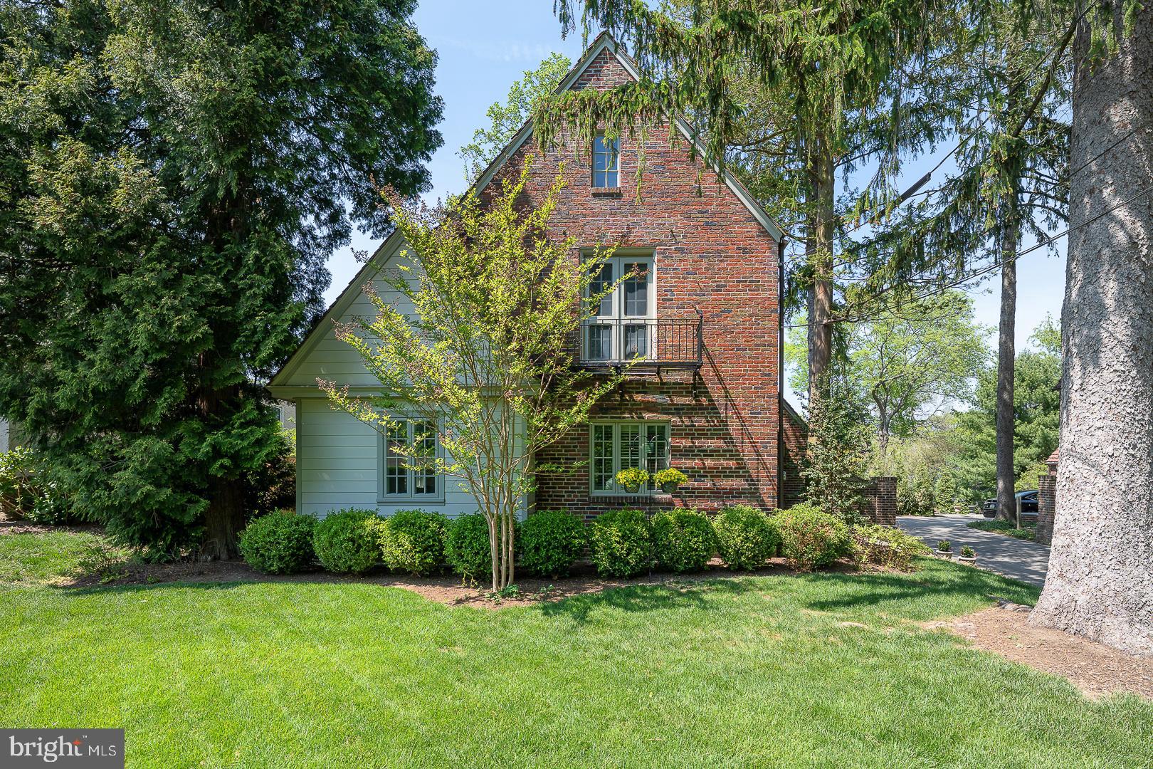 Welcome to 30 Deepdale Road!!  
Take advantage of this rare opportunity to purchase an English style brick Tudor that artfully combines old world charm with modern amenities. If you have been seeking a truly SPECIAL home, look no further!!  Located within the award winning T/E school district, and only a short distance from the Strafford Train Station, Farmer’s Market and the town of Wayne!  
 
Enter through the arched front door of this idyllic home and step into gracious living!!
Down a few steps, the inviting living room incorporates the warmth of a gas fireplace, custom millwork and built in bookcase creating the perfect atmosphere to curl up with a good book. Pass through beautiful  French doors as you enter the updated (2018) kitchen which boasts 42" white cabinetry, a spacious island with abundant storage and quartz countertops, Monogram Profile Series stainless appliances, a wine refrigerator and hardwood flooring. The kitchen and living room flow seamlessly into the stylish dining room with beamed ceiling and a white washed brick wall.  Beyond the Kitchen is a well appointed Butler’s Pantry (also renovated in 2018) with built in cabinetry, custom wood counter tops, 'brick look' tile flooring, and a writing desk. Finishing off this space is a bench/cubby area with four built in coat hooks as well as a powder room with pedestal sink. As you make your way through the back door, you are greeted by a magical private garden- complete with flower/herb stone lined garden areas, a fully fenced yard, large slate patio and a grassed play area perfect for entertaining. Completing the lower level is an attached two car garage. The shared driveway allows for off street parking of two cars outside of the garage of each home.
 
Upstairs, the primary bedroom is made complete with a huge walk in Designer Closet, oak hardwood flooring, crown molding and atrium doors to a lovely balcony. The primary bath (renovated in 2020) is enhanced by radiant heated flooring, huge quartz (Chipped Ice) double sink vanity, Vallelungo Italian tile flooring, large glass enclosed tile shower and vaulted ceiling. Contained within the primary closet are a large vault and a secret door which opens to a third floor attic for additional storage as well as a large cedar closet ideal for off season clothing. Finishing off the main upper level are two additional bedrooms and an updated full bath with artisan tilework on floor, walls and vanity as well as a large glass enclosed tub/shower.

From the butler's pantry there is a back staircase leading to the fourth bedroom which would be ideal as an au pair or in-law suite.  It features hardwood flooring, updated windows and plantation shutters. The  attached private bath has tile flooring, a full glass shower and lovely vanity with a blue glass sink.
 
On the lower level, the basement contains a carpeted workout room with mirrored walls, (extra motivation!) the laundry room which has built in cabinets and shelving, a tiled second powder room and a storage room.

The lucky new owners of this home will delight in all that it has to offer...proximity to SEPTA regional rail (offering easy access to Philadelphia), Route 30, 202 and the turnpike, wonderful shopping and dining in Wayne and King of Prussia and award winning T/E schools, and the honor of calling this one of a kind treasure HOME!