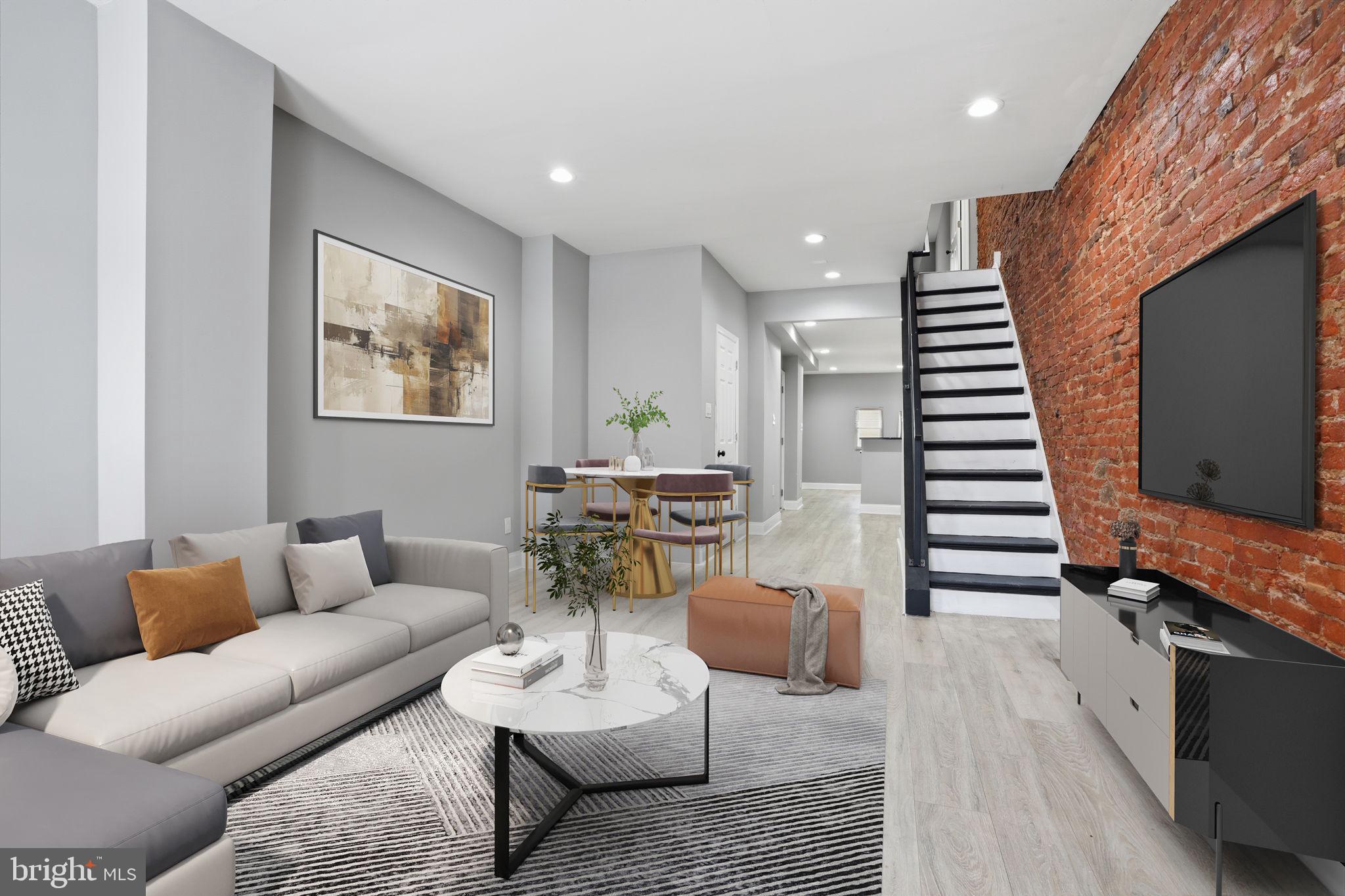 Welcome to 1933 E Somerset St — a beautifully renovated 3-bedroom, 1.5-bath home that blends modern comfort with classic character. This home features an open-concept layout with striking exposed brick, creating a warm and inviting space perfect for relaxing or entertaining. The updated kitchen offers stylish cabinetry and ample storage, seamlessly flowing into the main living area. Enjoy year-round comfort with central air, along with the convenience of a main-level half bath. Upstairs, you'll find three well-sized bedrooms and a full bath. Step outside to a spacious private backyard, ideal for entertaining, gardening, or giving pets room to roam. This move-in-ready home offers the perfect mix of charm, updates, and functionality.
