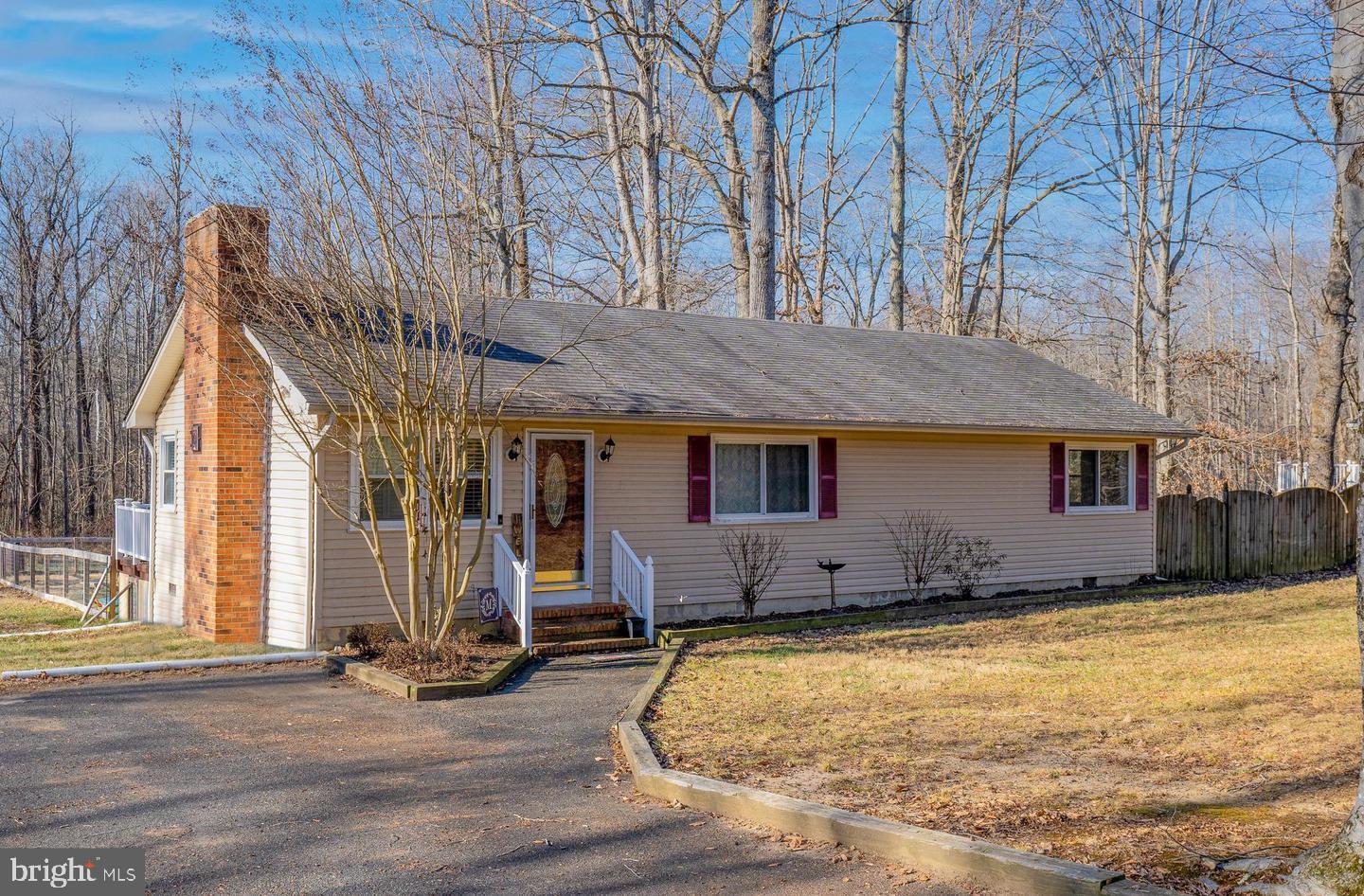 Approx. 3 acres,partially wooded and backs to Aquia creek. Pet friendly with large fenced-in backyard and small concrete patio under the trees. Single car detached garage with additional covered carport. Plenty of parking. Option to keep three egg laying hens. Tons of room for gardening. Rent includes semi-annual water system maintenance. Renter will  have access to Lake Arrowhead community pavilion, lake beach, and play area. Renter pays all utilities. Xfinity cable or T-Mobile internet service available in the area. 15 minutes to back gate of MCB Quantico. Must have good credit.  Pets case by case. Farm animals case by case. No sight unseen applications