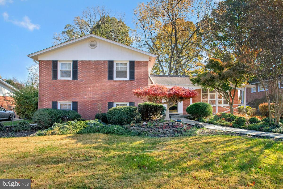 Meticulously maintained brick split-level in desirable Hillandale Heights neighborhood. This home features three finished levels, with ample space for entertainment, pets, family, gardening, or quiet time on the tranquil cul-de-sac. Upon entering, you’ll be greeted with a panoramic view of the spacious family room and elegant kitchen with vaulted ceilings, plantation shutters, granite counter tops and stainless-steel appliances. The main level features original hardwood flooring that follows throughout this well-appointed home. Additional touches include open floor plan on main level, large dining area with ample space for entertaining, easy access to large, level yard through sliding glass doors. Ascend to the second-floor master with ensuite bath, his and hers closets and adjacent hallway bath with jetted tub. Upper level has ample space for friends, family, hosting with three bedrooms and two full baths. The daylight basement has a fourth bedroom and third full bath with stall shower. Full-sized washer and dryer at basement laundry with access to large storage room, bonus room perfect for pool table and entertaining. This home has been lovingly cared for, its beautifully landscaped grounds with mature tree lined front yard, includes cherry, crepe myrtle and pine trees. Parking is available on street or off street at paved entry.  Conveniently located near commuter routes, 495, downtown Silver Spring, restaurants, hospitals, and more.