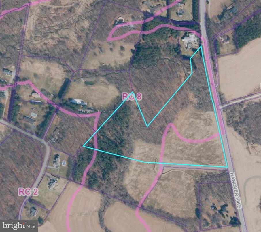 MOTIVATED SELLER!! - 1 of 3 lots available in new custom home community. 15+ acres offers large building area. Level, open and backing to trees. This is a finished lot with well, perks and utilities. Minimal covenants. Call for plats and additional info.