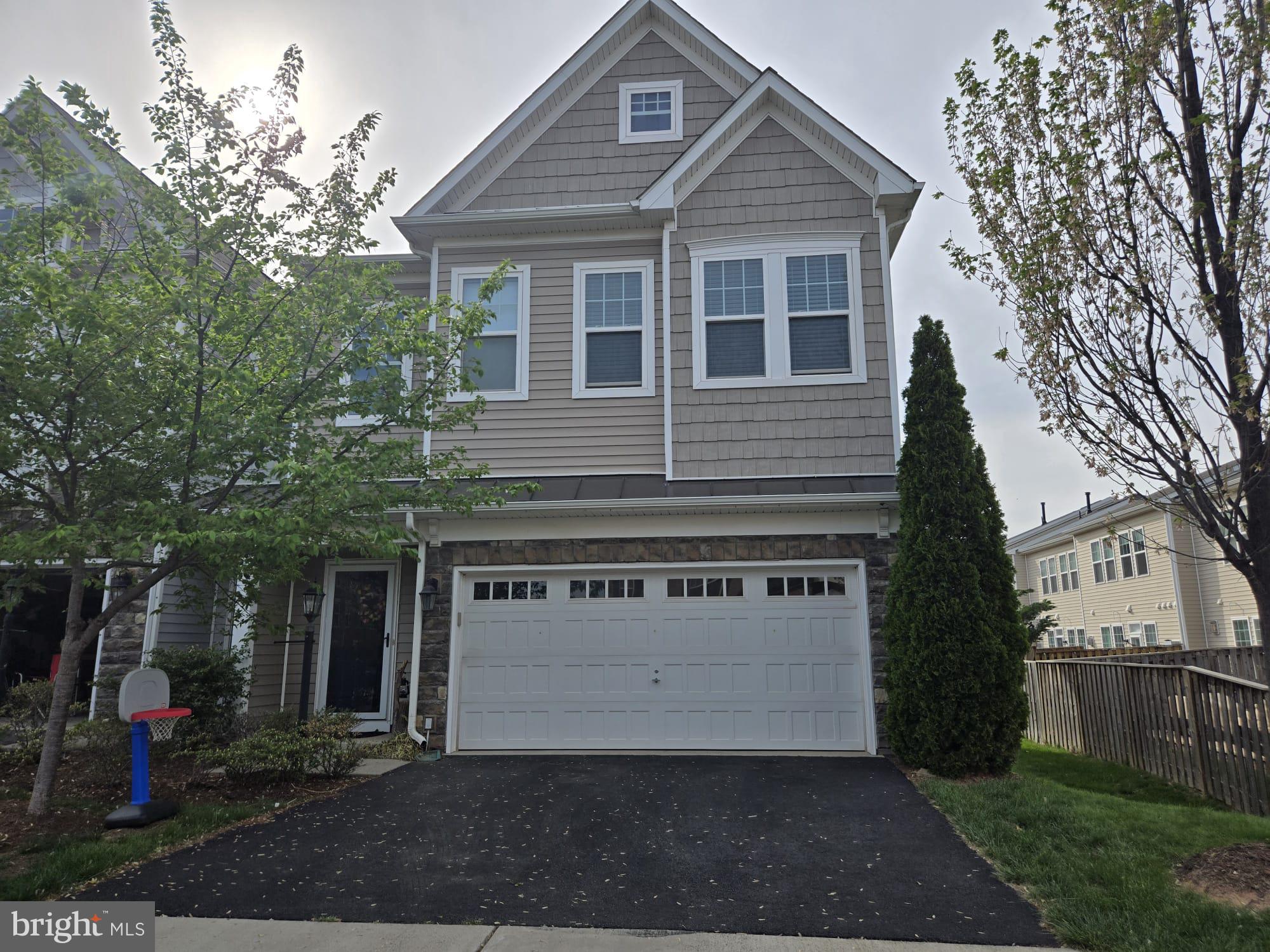 EXCELLENT TWO LEVEL END UNIT TOWN HOME! MAIN LEVEL BEDROOM with FULL BATH. Spacious open floor plan includes family, kitchen and dining room. Large windows and glass door that lead out to the rear back yard. Gourmet kitchen with extended island, SS appliances. Huge MBR w/FBA & 2W/I closets, 2 Car Front Garage. Fenced in outdoor with concrete patio. Near to Routes are 606, 50, 28, 267 and Silver Line Metro. HIGH SPEED FiOS INTERNET AND BASIC CABLE INCLUDED IN RENT.  AVAILABLE TO RENT FROM JUNE 3RD 2025.