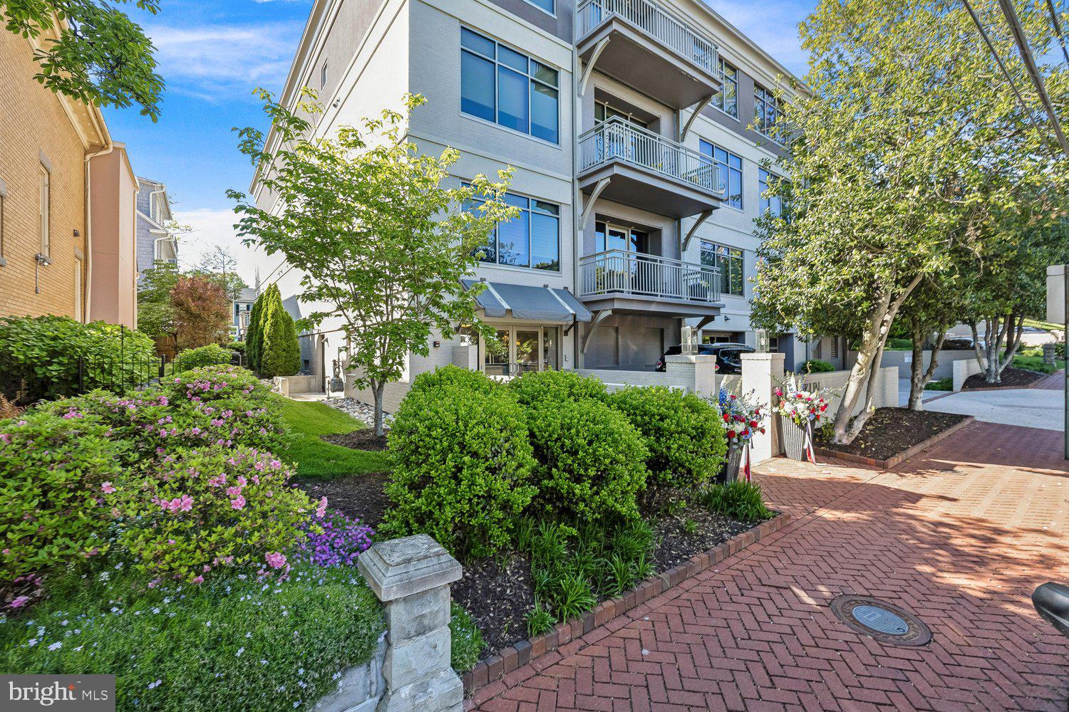 Rarely offered ground level residential condominium located at the intersection of Murray Hill and the city's Historic District. Secure garage parking for 2 cars, plus driveway parking for an additional vehicle w/private entry.  Originally developed by John Pilli & constructed by Gate One custom builders, this exquisite residence was built with luxury high-end finishes including Legno Bastone wide-plank hardwood flooring, Caesarstone counter-tops, Omega cabinetry, Thermador appliances & beautiful designer selected plumbing and lighting fixtures. Recently re-built by Lynbrook of Annapolis with numerous, thoughtful additions including fireplace, soaking tub, multiple built-ins, extra closets and sliding doors for privacy.  Featuring 9.5' ceilings, expansive windows, & enormous outdoor patio with off-street parking & EV charger.  and interior space of 2269 sq feet. Amenities include elevator, rooftop terrace w/views of Spa Creek and city skyline, secured covered parking, gas cooking and water usage.  Located in a premier and quiet section of downtown Annapolis yet an easy walk to the water at Goose Park, Main St shops, restaurants & the West St Arts District. Luxury lock & leave at its finest!