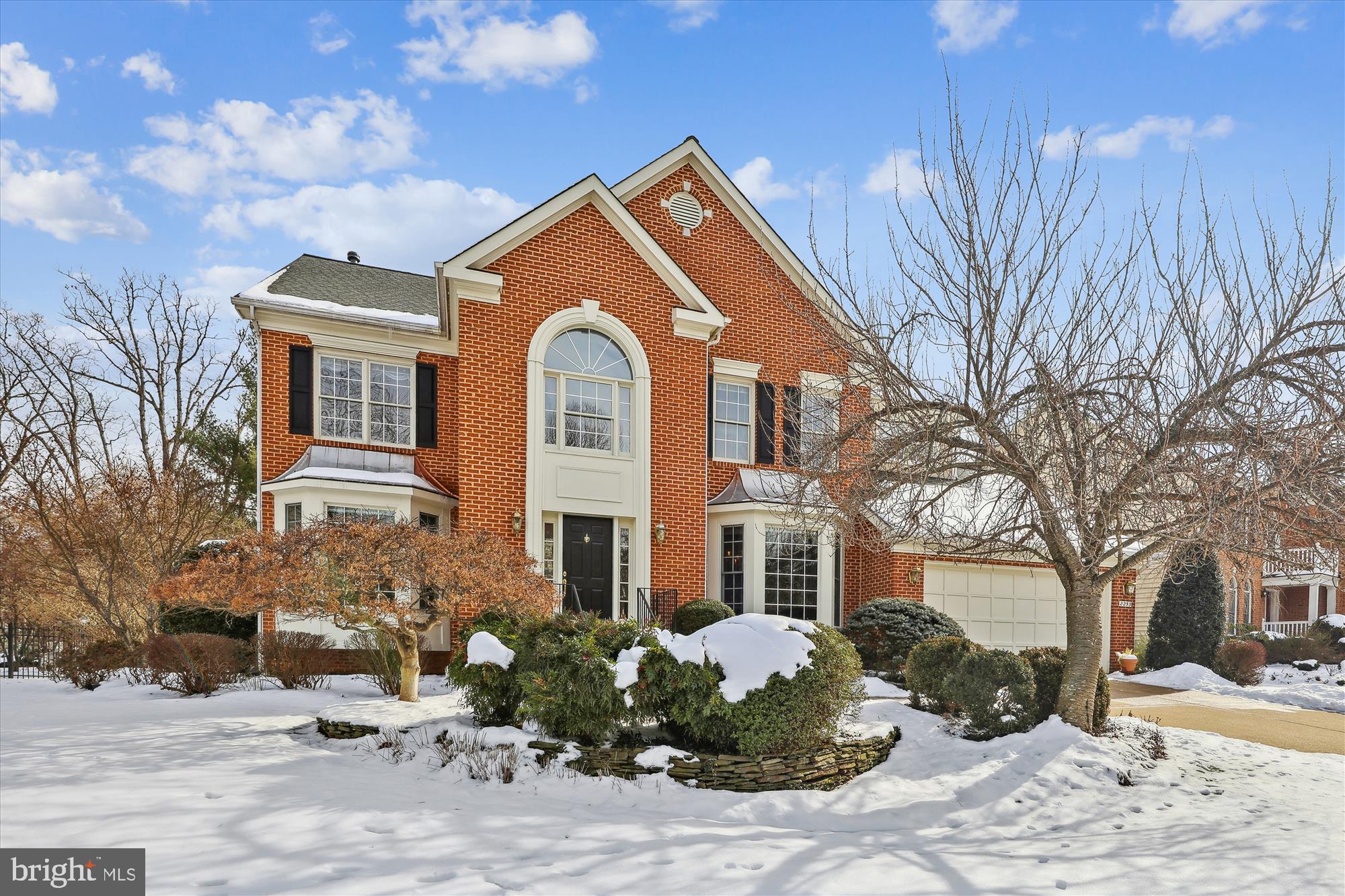 Regal Oaks is the perfect name for a small community of elegant homes in a quiet, private setting that is convenient to Tysons, DC, Mosaic, Metro and more.
This home stands majestically on 1/3 acre that is framed with lush landscaping. Pride of ownership is evident throughout the home.
From the inviting foyer one can see the lovely living room and spacious dining room. The kitchen, with its octagonal island, has all the beauty of a carefully remodeled kitchen that opens to a deck, screened porch and patio providing the ideal spot for barbecuing, relaxation and entertaining. A convenient office and comfortable family room with a fireplace add to the appeal of this home. An elegant powder room completes the main level.
The upper level features four bedrooms with new carpeting and three updated bathrooms. The large primary suite includes a sitting area for reading or morning exercises.
The lower level has been masterfully finished with kitchen facilities, a wet bar, a fireplace, full bedroom and full bath. Perfect for guests, extended family or a live-in nanny or caretaker.