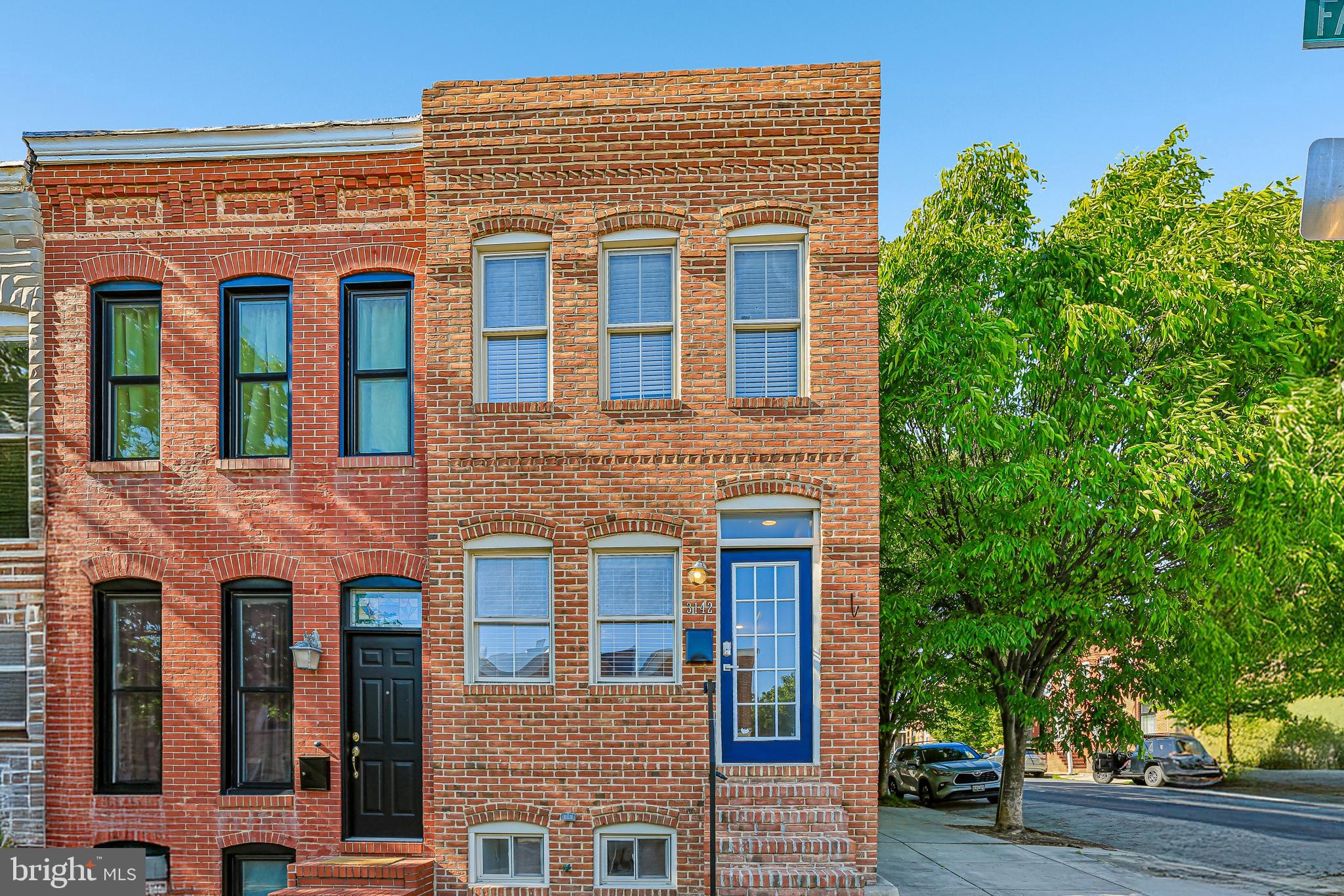 Experience elevated city living in this beautifully upgraded end-of-group Canton home, featuring a rear garage, panoramic rooftop views, and premium finishes throughout. Flooded with natural light from multiple exposures, this exceptional residence offers an open-concept layout with high ceilings, elegant crown molding throughout, recessed lighting in every room, and Brazilian cherry hardwood floors, adding rich warmth, depth, and a timeless elegance that elevates the entire home.

The main living space is thoughtfully designed for both comfort and entertaining, featuring expansive living and dining areas with a seamless flow into a beautifully appointed kitchen showcasing timeless black granite countertops, stainless steel appliances, a double oven gas range, a bottom-freezer drawer refrigerator, and under-cabinet lighting that enhances both function and style. A striking focal point is the custom wrought iron floating staircase, adding architectural character and a modern edge. The living room is further elevated by an elegant tray ceiling that adds depth and visual interest, and is pre-wired for surround sound, offering an enhanced entertainment experience.

The primary suite provides a relaxing retreat, complete with vaulted ceilings, a spacious walk-in closet, and a beautifully designed en-suite bath featuring dual vanities, a soaking tub, and a separate shower. Full-size washer and dryer are conveniently located on the upstairs bedroom level. 
Enjoy outdoor living at its finest on the private rooftop deck with incredible panoramic views of downtown Baltimore, Fort McHenry, and seasonal fireworks displays.

The lower level has been thoughtfully updated to include a private, fully enclosed bedroom with two front-facing windows that bring in abundant natural light. Fully carpeted throughout, the level also features a centrally located flex space—ideal for a home office, workout area, or additional living space.
Additional highlights include a full-size rear-entry garage with an extra-wide door, keyless Wi-Fi–enabled locks on exterior doors, and a pre-wired security system with existing window and door sensors and a motion detector, with system components in place and ready for activation.
Ideally located just blocks from Canton Square, Merritt Athletic Club, Harris Teeter, and Sprouts, this home offers the perfect blend of luxury, convenience, and vibrant city living.