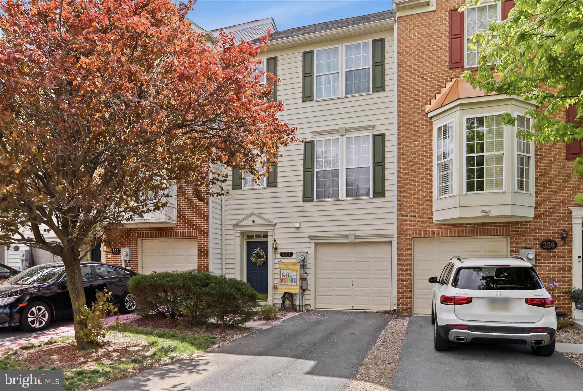 Beautifully upgraded townhome in the Enclave! Walkthrough the front door into a large first floor family room. The second floor houses the kitchen with beautiful granit countertops and a conveniently placed island. The dining area adjoins the kitchen and allows for a nice view to the deck area. Adjacent to the dining and kitchen area is a cozy sitting room with a fireplace. The balance of the space on the first floor is a large living room. Upstairs you will find a large primary suite and bedrooms two and three. The backyard is fenced in and has both a deck and a very large wooden patio! You won't want to miss this one!