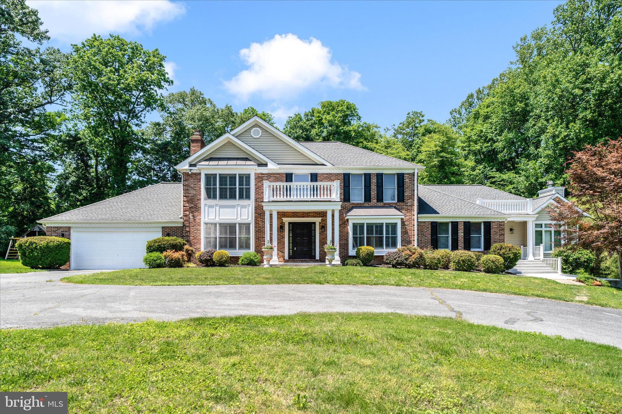 Don't Miss Out on this rare, wonderfully private, expansive 3.5+ acre property in fantastic location!  This 4-5 bedroom 3.5 bath brick-front home with private lot, circular driveway, and separate detached garage has so much potential, especially for multi-generational estate living with plenty of parking and space to spread out.  Many upgrades/updates made over the years with large rooms and convenient layout/flow - granite counters, additional kitchen, hardwood floors, 2 fireplaces, low-maintenance deck, light-filled sunroom, fantastic great room, so much more!  Part of Jocelyn Acres  HOA with access to private community lake - great for fishing, kayaking, picnicking, etc.  Close to everything - River Hill schools, Clarksville, Columbia, and Olney (MoCo).  A must see!