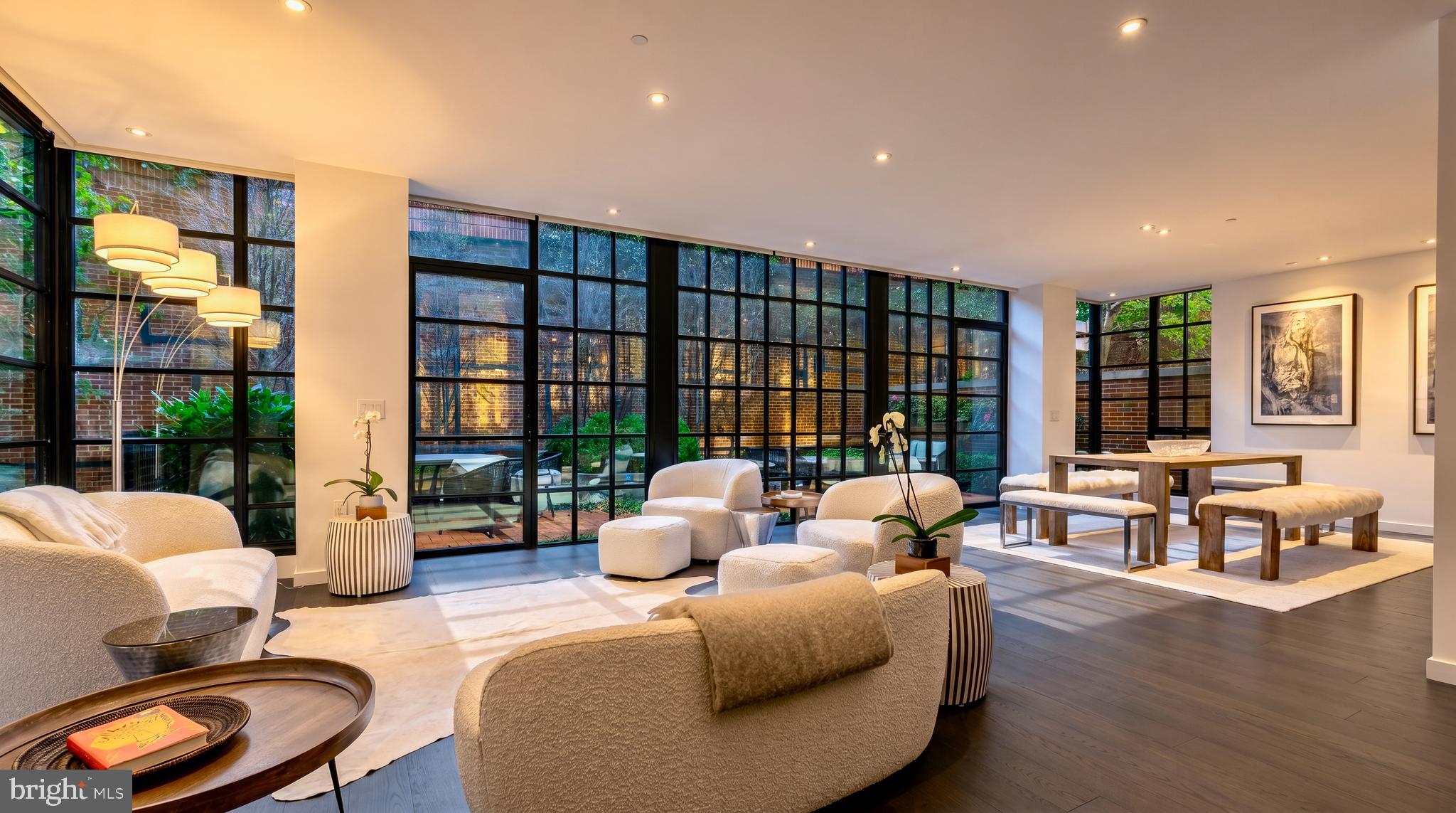 This exceptional 2-bedroom + DEN, 2.5-bath residence offers a sophisticated blend of scale, design, and indoor-outdoor living rarely found in condominium living. Thoughtfully remodeled with refined finishes and elegant architectural details throughout, the home delivers an elevated lifestyle in one of Georgetowns most prestigious full-service buildings.

A gracious gallery entry welcomes you into expansive living and dining spaces framed by dramatic floor-to-ceiling wraparound windows overlooking the beautifully redesigned private terrace. Seamlessly extending the living experience outdoors, the professionally curated terrace features custom stonework, slate, brick, integrated lighting, raised planters, irrigation, and bespoke seating areas, creating a distinctive outdoor retreat ideal for entertaining, dining, or quiet relaxation.

The reimagined gourmet kitchen is both functional and striking, featuring an oversized island, Boffi Italian cabinetry, honed Calacatta quartz countertops, and a premium suite of appliances including Miele ovens, Gaggenau gas cooktop, SubZero freezer drawers, and Wolf ventilation.

A rare glass-enclosed den with custom built-ins adds exceptional versatility and serves perfectly as a private office, library, media lounge, or additional living space, a highly desirable feature seldom available in condominium residences.

The spacious primary suite serves as a luxurious retreat complete with custom walk-in closets, additional side-by-side closets, and a spa-inspired bath featuring heated floors, soaking tub, double vanity, and AntonioLupi Italian fixtures. The secondary bedroom features sophisticated sliding architectural doors allowing flexibility as a guest suite, lounge, or workspace.

Additional highlights include two secured garage parking spaces, a private storage unit, Porro Italian closet systems, Lualdi Italian doors, wide-plank oak flooring, designer lighting, custom Lutron shades, and Ecobee-controlled five-zone HVAC.

Residents enjoy the white-glove lifestyle and premier amenities of 3303 Water Street, including 24/7 concierge service, rooftop saltwater pool with sweeping river views, fitness center, conference room, herb garden, bike storage, car wash station, and pet-friendly accommodations. Perfectly positioned between Georgetown Waterfront Park and the C&O Canal, this residence offers immediate access to Georgetowns finest dining, shopping, and cultural destinations.