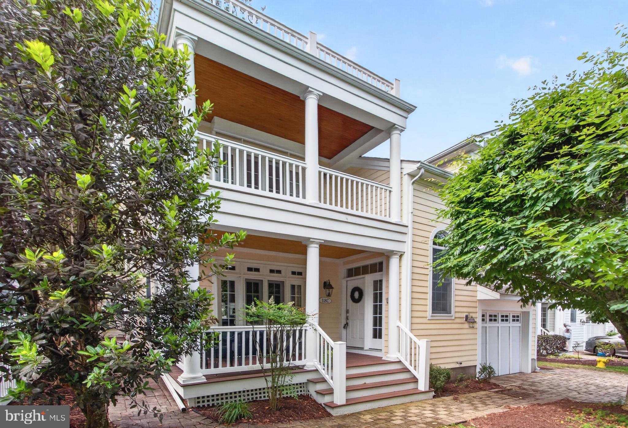 Sophisticated South Rehoboth cottage—just over a block to the beach. Experience timeless coastal luxury at the Cottages at Philadelphia Place, an intimate enclave of eight distinctive Charleston-style homes. Thoughtfully designed by architect George Hay and masterfully built by Coffin Construction, this residence features an airy open layout with solid hardwood floors, multiple inviting porches, and a partially finished basement with exterior access. The chef-inspired kitchen, elegant living areas, and two fireplaces provide modern comfort and year-round livability. With four en-suite bedrooms plus a den, the home accommodates guests effortlessly. The primary suite impresses with vaulted ceilings, a private covered porch, a spa-inspired bath, and a second fireplace. The lower level adds exceptional versatility with a large bonus room, full bath, storage area, and secondary laundry. Additional highlights include a 1-car garage, outdoor shower, and off-street parking. With strong weekly rental potential, this home offers the perfect balance of coastal retreat and investment opportunity. Offered mostly furnished.