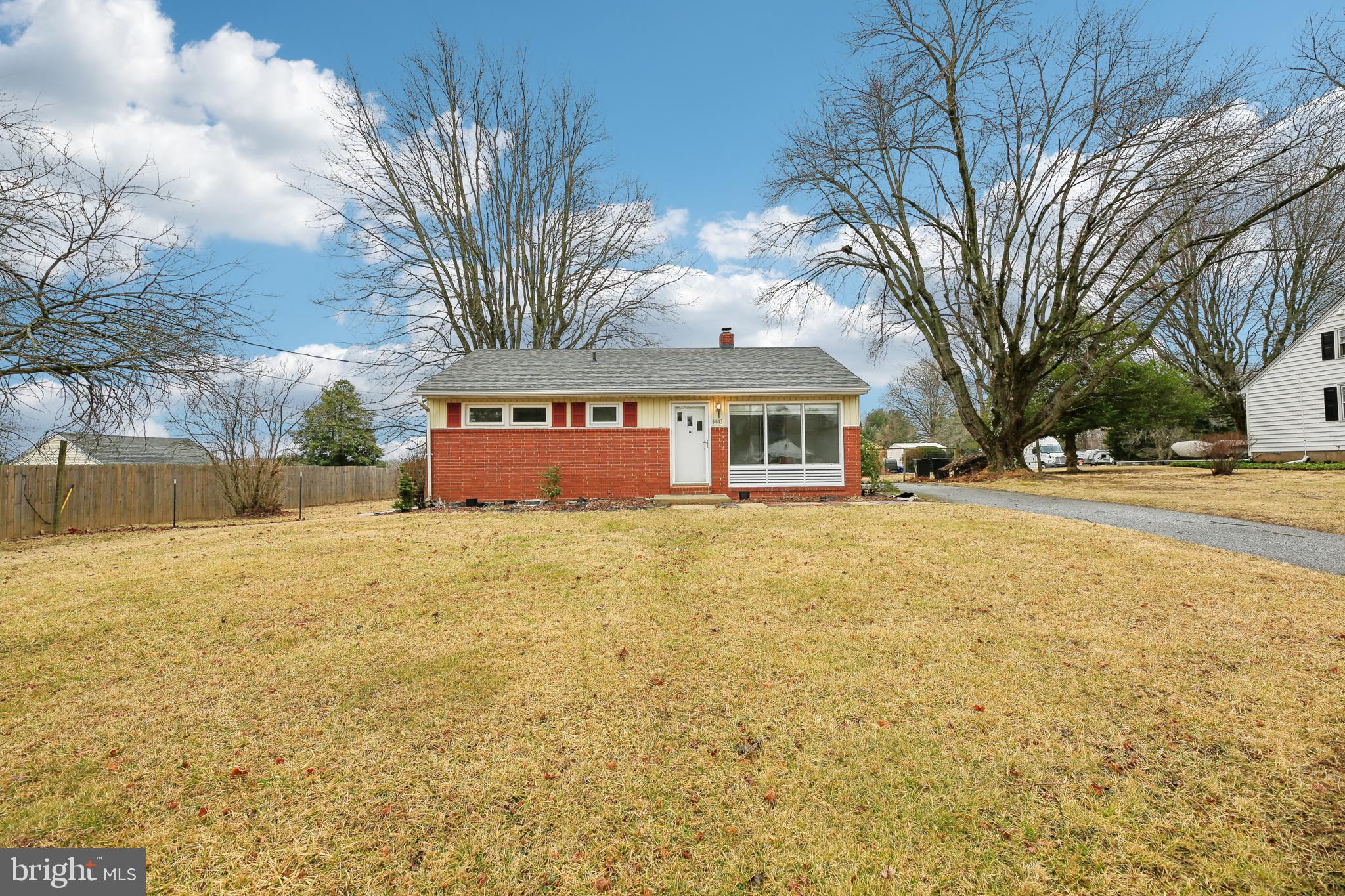 This move-in ready home features refinished hardwood floors throughout the living room, hallway, and all three bedrooms. The kitchen boasts brand-new flooring and a new electric range, perfect for preparing meals. Stay comfortable year-round with newly installed ceiling fans in the bedrooms and kitchen. With a roof that's less than a year old, this home offers peace of mind for years to come. The new rear deck provides an excellent space for outdoor entertaining or relaxing. Additionally, the lot directly behind the property on 5th Street is included in the sale, offering extra space and potential. Don’t miss this fantastic opportunity!