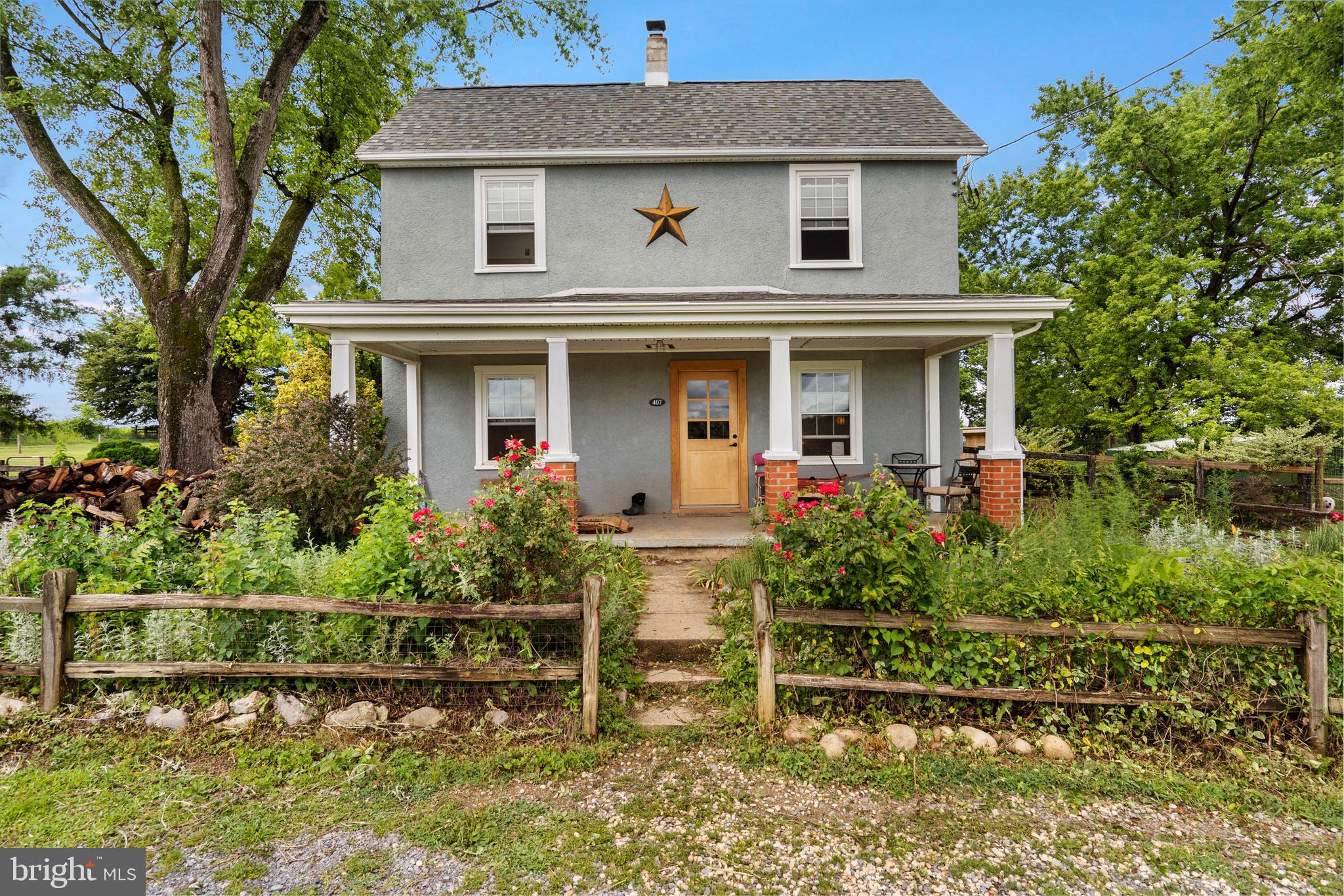 Escape to your own private country retreat! Located at the end of the lane, this 2.25-acre unrestricted property offers the perfect blend of comfortable living and small-farm functionality. Whether you're dreaming of horses, livestock, hobby farming, or simply enjoying wide-open spaces, this property is ready for it all. The land is fully enclosed with new fencing and gates thoughtfully divided into 4 separate spaces, making it ideal for animals and agricultural use. A large barn provides ample storage and shelter, while the detached 3-car carport features a workshop complete with its own electric meter—perfect for projects, equipment, or a home-based business. Inside, you'll find a home that has been extensively updated and well maintained. Some of the improvements include beautifully renovated bathrooms, finished attic space, energy efficient mini-split systems (heating & cooling) on each floor, updated plumbing and electrical, new windows, insulation, trim, lighting, fixtures, and appliances. A complete list will be uploaded to the documents. The welcoming 3-season porch offers the perfect place to unwind or relax on the front porch and enjoy the panoramic view of the surrounding mountains and rolling hills of WV. Offering privacy, flexibility, and many upgrades, this rare property delivers the freedom of country living. Whether you're looking for a homestead, mini-farm, or simply a peaceful place to call home, this property is must-see. Selling As-Is. 
Sellers would like to leave back-yard chickens (approx. 20) and Great Pyrenees livestock guardian dog (Brunella) d.o.b. Feb 2025, if buyers are interested.