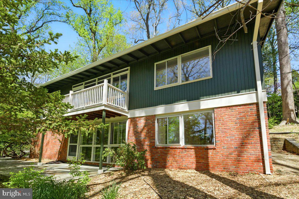 Nestled in the coveted Potomac Overlook community, 7211 MacArthur Blvd presents a rare opportunity to own a piece of architectural history. One of just 19 residences in Montgomery County’s only designated mid-century modern historic district, this striking home offers timeless design, serene surroundings, and the freedom to personalize the interior—all while preserving its iconic open exterior.

Designed by the acclaimed architectural firm Keyes, Lethbridge & Condon and developed by Edmund Bennett, this 4-bedroom, 3-bathroom home—including an in-law suite—is a masterclass in mid-century modern living. The designs clean lines, expansive windows, and a low-pitched gable roof that creates a seamless connection between the indoors and the surrounding natural landscape.

Set on over two-thirds of an acre of wooded land, the home offers exceptional privacy and stunning views of the Potomac River Valley. Inside, the freshly painted interiors highlight the home's warm modernist character, while the updated kitchen blends contemporary convenience with original charm, making it ideal for everyday living and entertaining alike. The spacious, detached garage offers room for two cars plus additional storage or workshop space.

Exterior updates, including fresh paint, enhance curb appeal while maintaining architectural integrity. The home’s layout is thoughtfully designed for comfort and flexibility, with generous living spaces and a private suite perfect for guests or multi-generational living. Owners have the ability to modify interior spaces or build additions, provided the street-facing façade remains unchanged—preserving both privacy and heritage.
Living in Potomac Overlook means joining a community that values modernist architecture, natural beauty, and intentional design. Quiet, winding roads without intrusive sidewalks and mature trees on large lots give the neighborhood a tranquil, park-like feel. Yet you’re only minutes from downtown Bethesda and the cultural offerings of Washington, D.C.
7211 MacArthur Blvd is more than a home, it’s an opportunity to live in harmony with nature and architecture, in one of the region’s most architecturally significant enclaves.
Experience the elegance of mid-century modern living—schedule your private tour today.