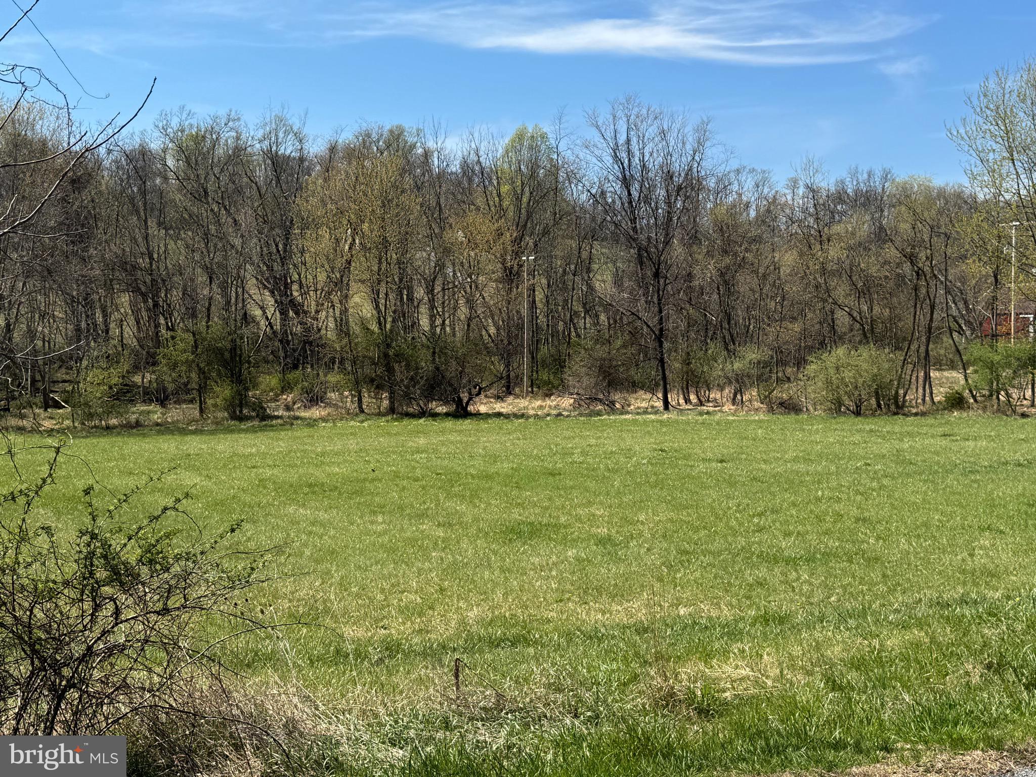 1.66 acre flat building lot in Middletown School District.  There is a small dwelling on property with kitchen, living room, 1.5 bathrooms, loft/bedroom ensuite with walk-in closet, washer and dryer, hot water heater, pressure tank, 2 mini splits (heat and AC).   Separate garage on property too. Call listing agent for further information regarding the dwelling, well and septic.