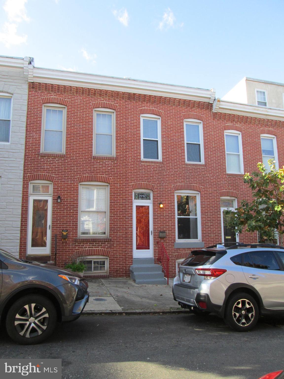 Charming Inner Harbor Row Home, Lots of Space & Light. Upper Level Large Master Bedroom, 2nd Bedroom and Full Bath. Main Level Living Room Dining Combination with Hardwood Floors and Powder Room. Cozy Eat in Kitchen with plenty of room.  Lower Level Fully Finished Basement, with space for Studio or Office. Freshly Painted, New Carpeting, Refinished Hardwood Floors, with Ceiling Fans throughout. Warm & Inviting Fenced in Courtyard Patio that has Potential for Parking Pad.This property is ready for move in, very clean. Walking Distance to Inner Harbor, Locust Point, Shopping Centers and more. View the Water of the Inner Harbor from the Front Steps. Easy Access to 95 & 295.