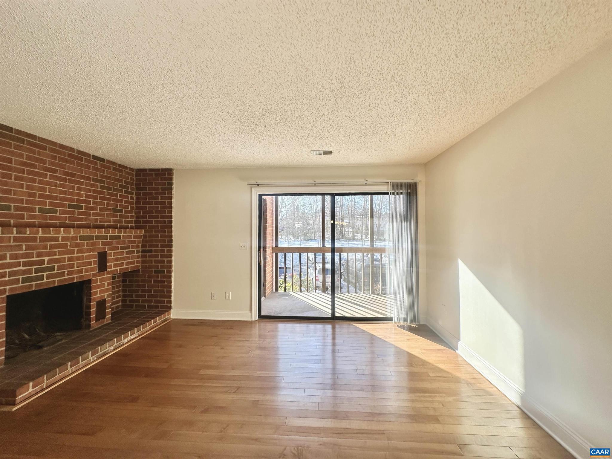 Beautifully renovated second-floor two bedroom condo. The condo was renovated to the highest quality with hardwood floors, cherry cabinets, granite countertops, stainless-steel appliances, and ceramic tile. The living room also features a wood-burning fireplace with an extensive brick hearth. The covered porch overlooking Turtle Creek is the perfect place to relax after a long day. There is abundant storage throughout the condo including walk-in closets in the bedrooms, a storage room off of the porch, a coat closet, a pantry, and a separate laundry room with a full-size washer/dryer. Kitchen features range, refrigerator, microwave, dishwasher, and garbage disposal.   Luxury condo living on Hydraulic Road, right next to the Shops at Stonefield! . Turtle Creek is an established community with all the amenities: 2 swimming pools, 2 tennis courts, playground, fitness room, clubroom, and walking trails. Per the HOA no pets are allowed.,Cherry Cabinets,Granite Counter,Fireplace in Living Room