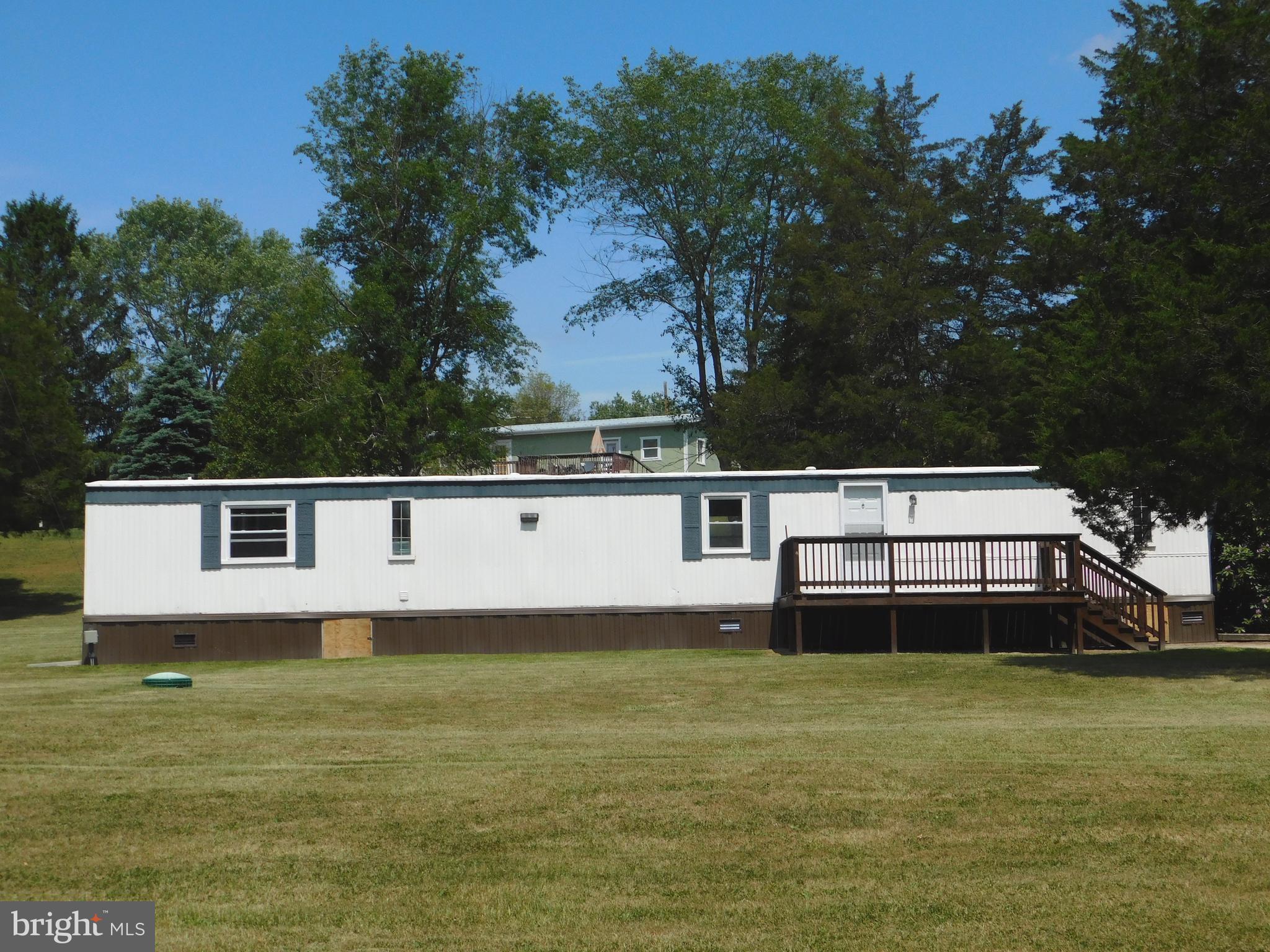 Location, location, location! Just 0.2 miles off Route 50, this well-maintained single-wide home offers comfort, updates, and convenience all in one package. Featuring 3 bedrooms and 2 full bathrooms, the split floor plan places the primary suite on the opposite end of the home for added privacy, complete with an ensuite bath.

Situated on a 0.83-acre mostly level lot, the property provides an ideal setting for outdoor enjoyment, entertaining, or simply relaxing in a peaceful setting. Recent updates include a refreshed kitchen with new cabinetry and appliances, new carpet throughout, upgraded insulation in the crawl space, and an HVAC system that is less than two years old.

Conveniently located approximately 30 miles from Winchester, VA, this home offers easy access to commuter routes while still providing a quiet, spacious feel.