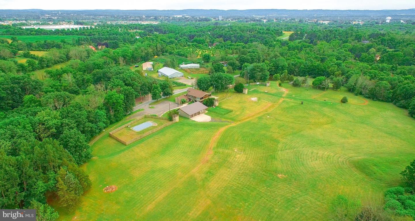 Builders, bring your vision . . .This 36 acre property, is not in Act 319 and has potential for subdivision. The land currently hosts a restaurant with apartment above, a second mobile home, and several pole barns. The property has plenty of options, you could keep the successful restaurant, rent it out, and/or build a planned community( high end or otherwise) to enjoy the all ready established clientele. Or take full advantage of the 36 acres zoned R1, that is on located on both sides of the road. The number of Lots will depend on the layout of the road ways proposed. Call the Listing agent with any questions and of course confirm with zoning your basic plans.