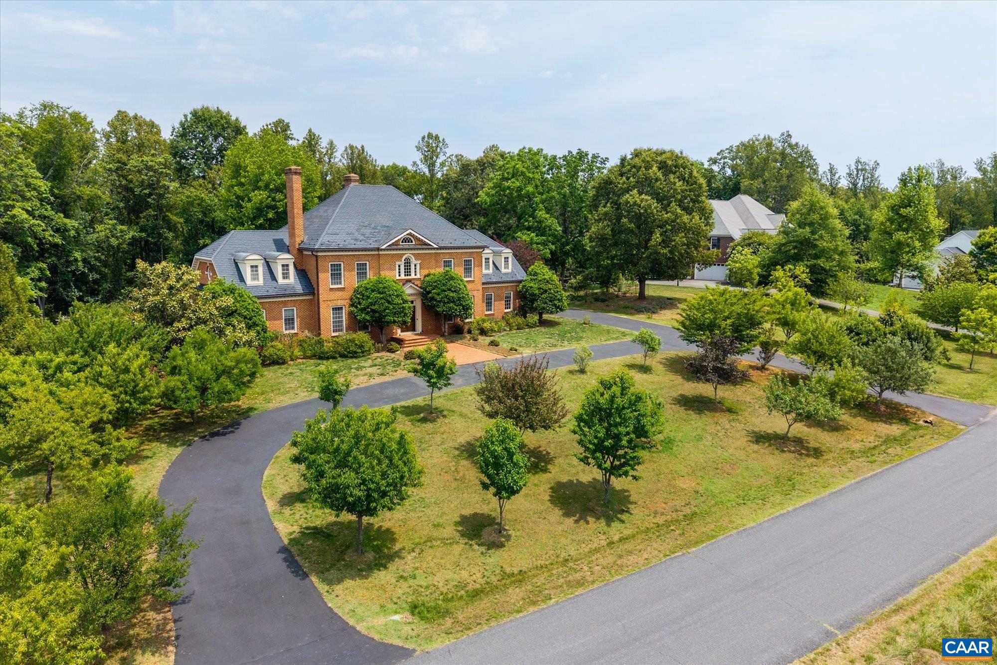 Located just five miles west of Charlottesville in the sought-after Old Ballard Farm neighborhood, this elegant brick Georgian residence offers exceptional quality, comfort, and space on two landscaped acres. Built circa 2006 and meticulously crafted, the home showcases beautiful moldings, custom cabinetry, and timeless architectural details throughout. Designed for both everyday living and entertaining, the floor plan features a spacious first-floor primary suite, a superb eat-in kitchen, multiple family gathering spaces, and abundant storage. Two staircases provide convenient access to the upper level, while family rooms on all three levels offer flexibility for a variety of lifestyles. The walk-out terrace level opens to a large fenced rear yard, ideal for recreation and outdoor enjoyment. Located within the highly regarded Western Albemarle school district, Old Ballard Farm is a welcoming neighborhood known for its strong sense of community and appeal to families of all ages. Ready for an immediate move-in, this home offers an opportunity to settle into one of Albemarle County's most desirable neighborhoods in time for the new school year.,Granite Counter,Wood Cabinets,Fireplace in Basement,Fireplace in Family Room,Fireplace in Living Room
