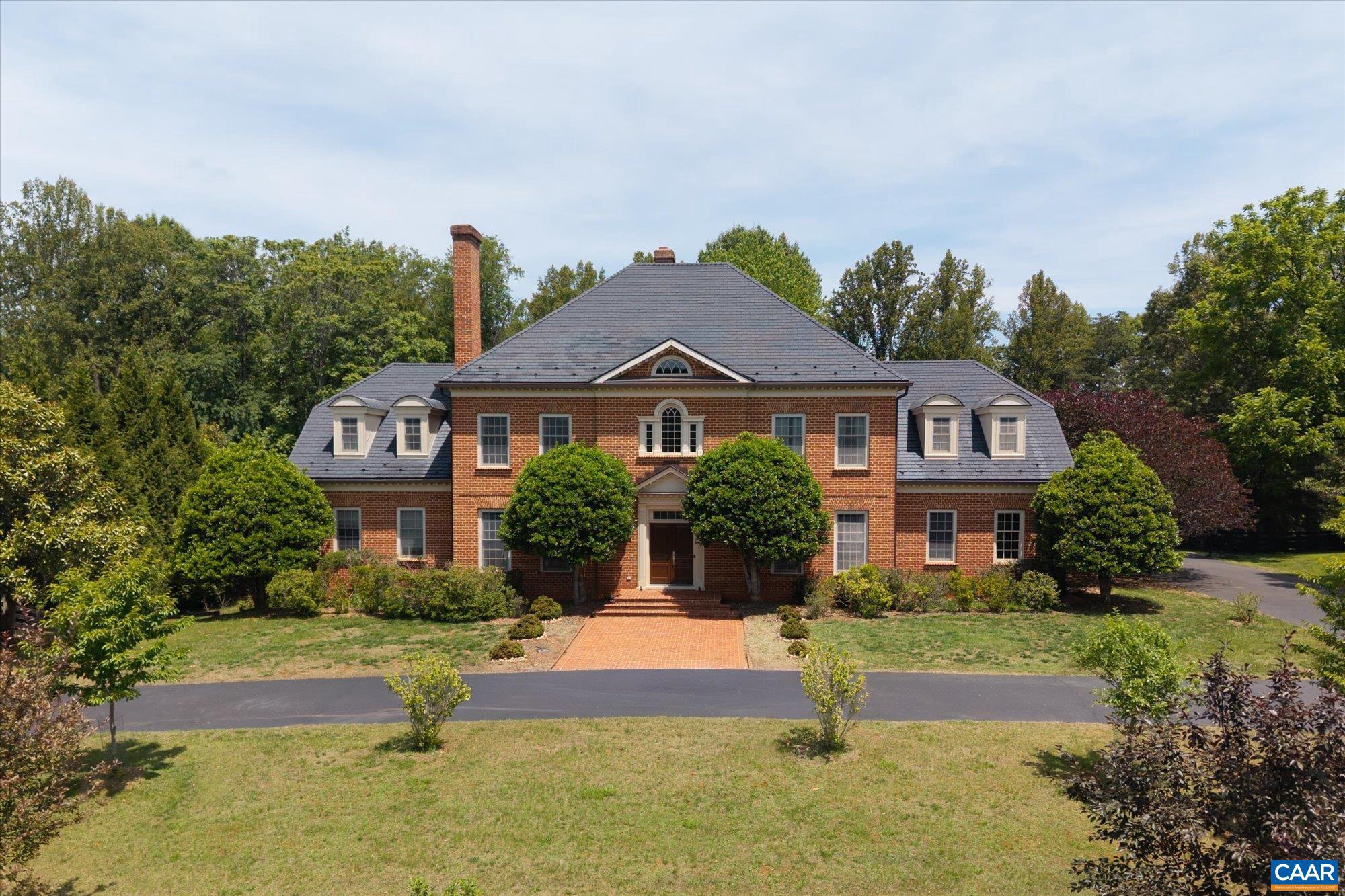 Located just five miles west of Charlottesville in the sought-after Old Ballard Farm neighborhood, this elegant brick Georgian residence offers exceptional quality, comfort, and space on two landscaped acres. Built circa 2006 and meticulously crafted, the home showcases beautiful moldings, custom cabinetry, and timeless architectural details throughout. Designed for both everyday living and entertaining, the floor plan features a spacious first-floor primary suite, a superb eat-in kitchen, multiple family gathering spaces, and abundant storage. Two staircases provide convenient access to the upper level, while family rooms on all three levels offer flexibility for a variety of lifestyles. The walk-out terrace level opens to a large fenced rear yard, ideal for recreation and outdoor enjoyment. Located within the highly regarded Western Albemarle school district, Old Ballard Farm is a welcoming neighborhood known for its strong sense of community and appeal to families of all ages. Ready for an immediate move-in, this home offers an opportunity to settle into one of Albemarle County's most desirable neighborhoods in time for the new school year. (Updated interior photos coming on 6/10/26 but current photos are a good representation),Granite Counter,Wood Cabinets,Fireplace in Basement,Fireplace in Family Room,Fireplace in Living Room