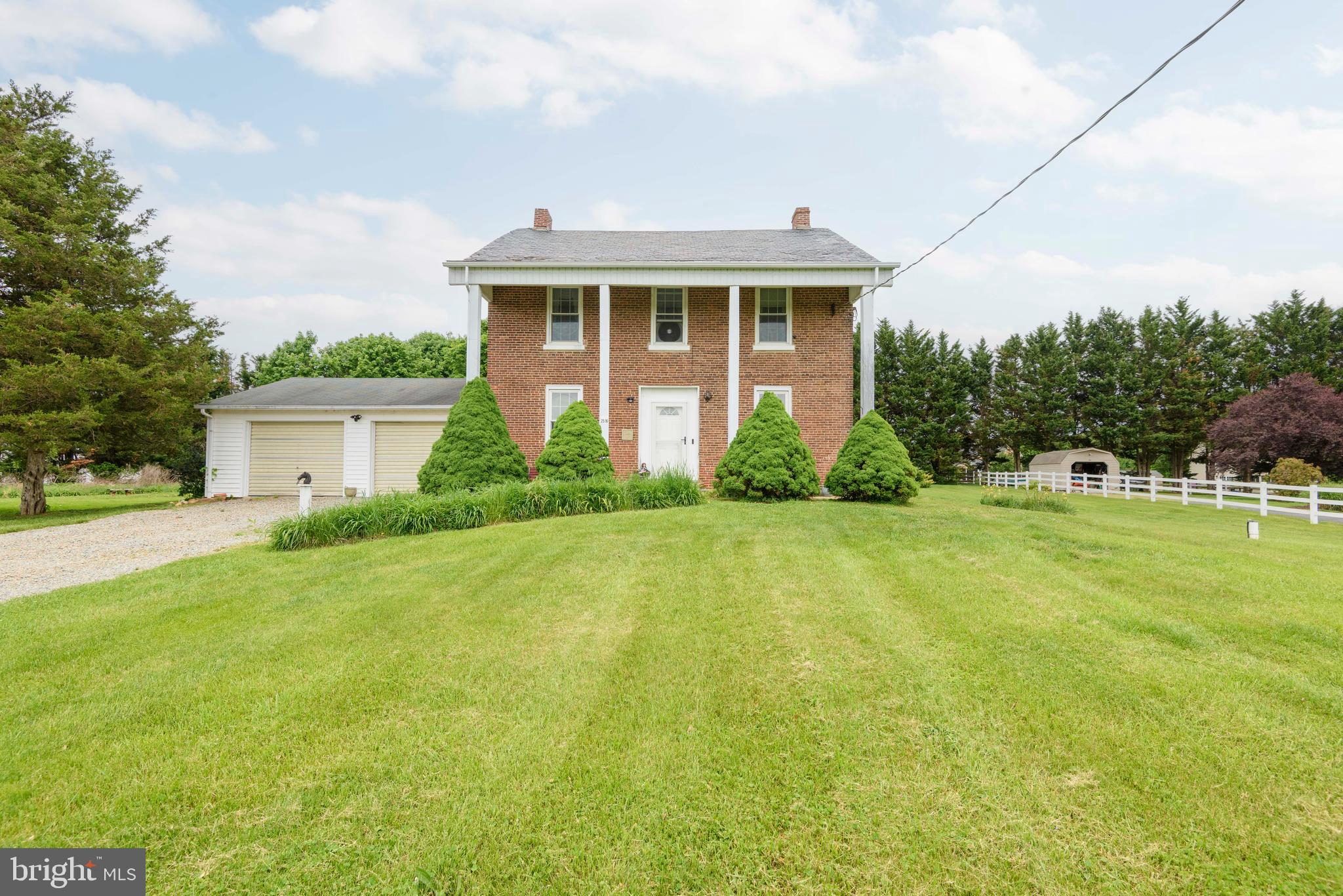 Circa 1744 | The Original Coulson Family Homestead

Step back in time and experience a rare piece of local history with this stately four-square, solid brick Colonial, beautifully set on approximately 2 picturesque acres in a serene country setting along Jacob Tome Memorial Highway.

Rich in character and heritage, this remarkable home traces its roots to the early Quaker families who settled the area under a Penn land grant. A welcoming front porch sets the stage, leading into a gracious center hall entry flanked by a formal living room and formal dining room each adorned with gleaming random-width hardwood floors, classic mantels, and abundant natural light. The dining room is further enhanced with elegant chair rail detailing, creating a refined space for entertaining.

The first floor features impressive 9-foot ceilings throughout, adding to the home’s timeless appeal. Toward the rear, you’ll find a functional, vintage kitchen with oak cabinetry, offering an opportunity for customization while maintaining the home’s historic charm. A cozy den provides additional living space and convenient access to the side yard. A powder room completes the main level.

Upstairs, the second floor offers four bedrooms, including a primary suite with a private powder room. A full hall bath serves the additional bedrooms.

Outside, the grounds are truly special mature trees, established gardens, and thoughtful landscaping create a peaceful, park-like setting. The tree lined driveway, accented by blooming dogwoods, adds to the property’s welcoming approach.

Additional features include a 24’ x 32’ barn with a 16’ x 7’ door—ideal for hobbyists, storage, or small-scale agricultural use along with an attached two-car garage.

Important updates include replacement of 19 windows and a new front door installed in 2022.

A rare opportunity to own a piece of Maryland history this timeless property offers character, charm, and endless potential in a beautiful rural setting.